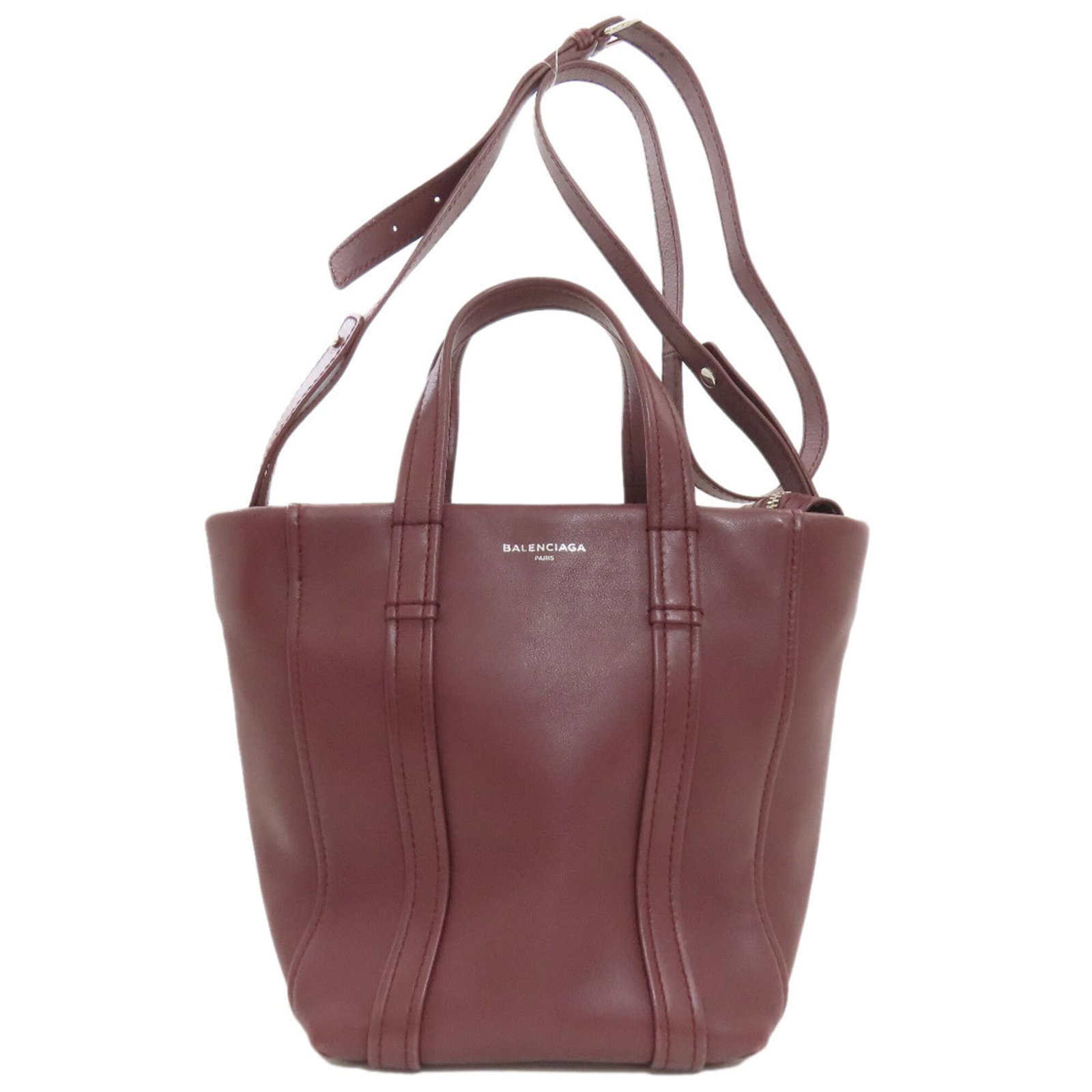 Balenciaga Handbag Leather: Balenciaga Handbag Leather Bordeaux leather handbag from Balenciaga, featuring a zipper closure and adjustable strap length. Measuring 23cm x 30cm x 15cm, it has a handle length of 28cm and comes in