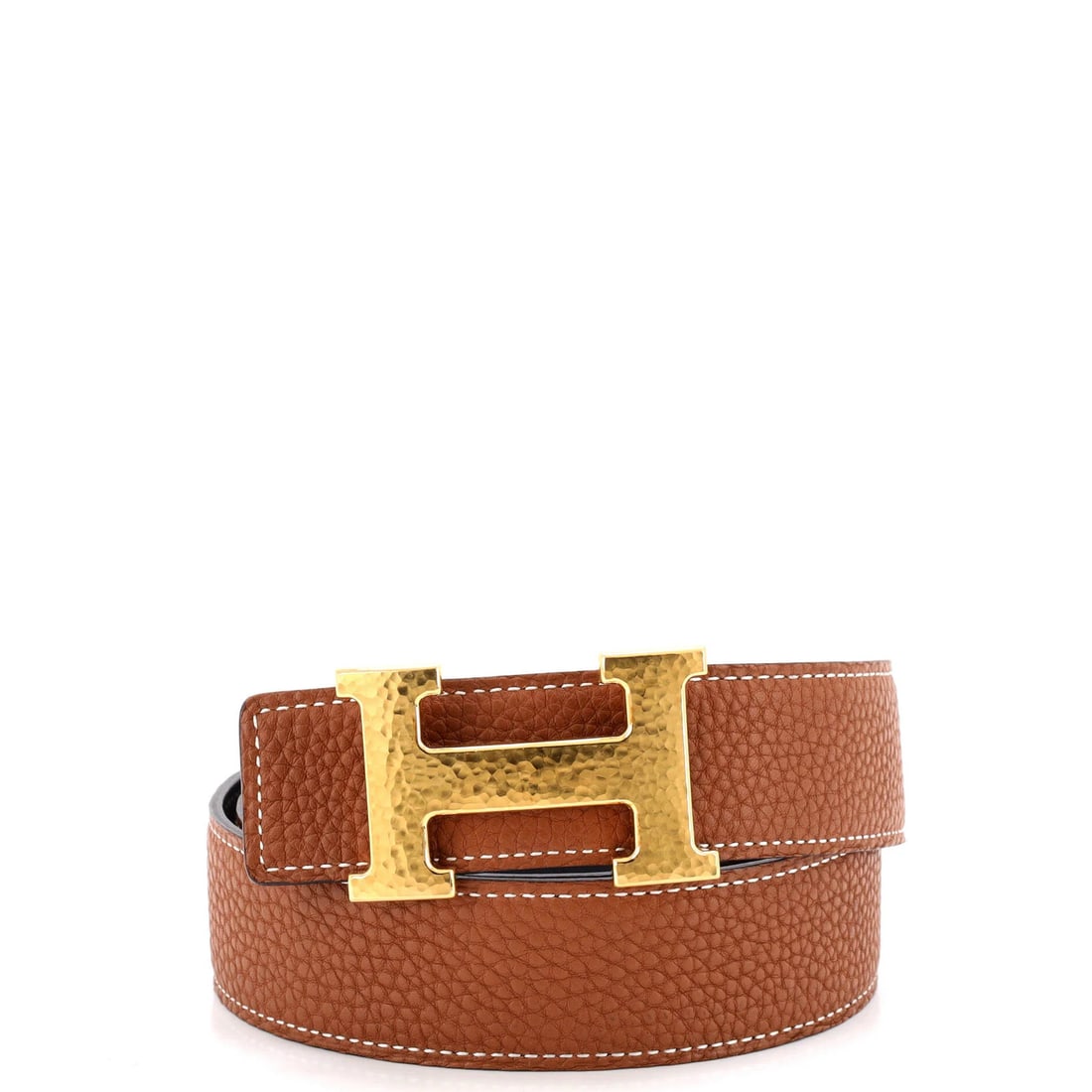 Medium leather reversible belt by Hermes: Medium leather reversible belt by Hermes The Hermes Constance Reversible Belt in brown leather features a medium size and classic design, with a reversible style that adds versatility to your outfit.