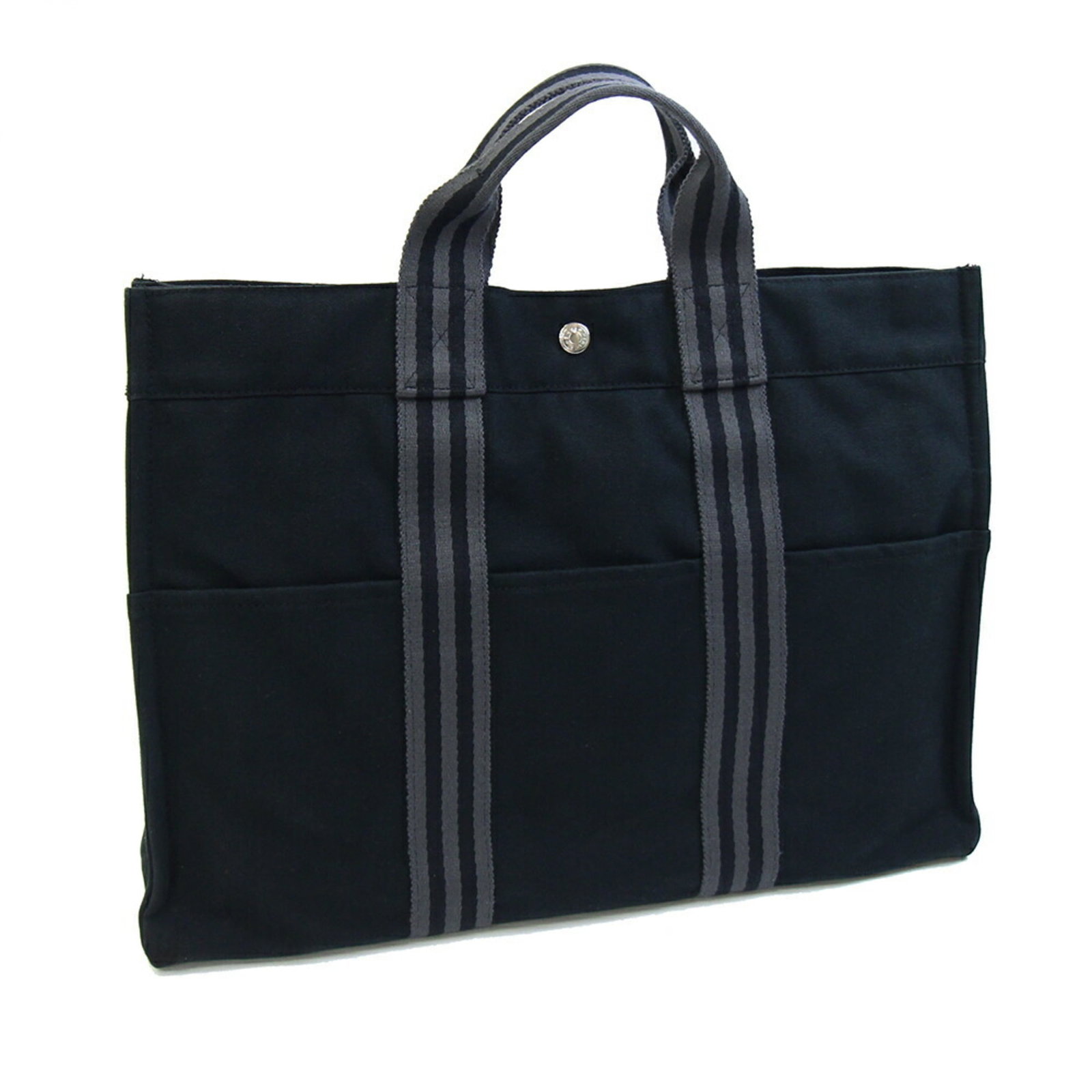 Cotton Canvas Handbag by Hermes: Cotton Canvas Handbag by Hermes Cotton canvas handbag by Hermes, crafted from high-quality cotton canvas in black. Measuring 32cm x 43cm x 9.5cm, this stylish bag features a classic design with clean