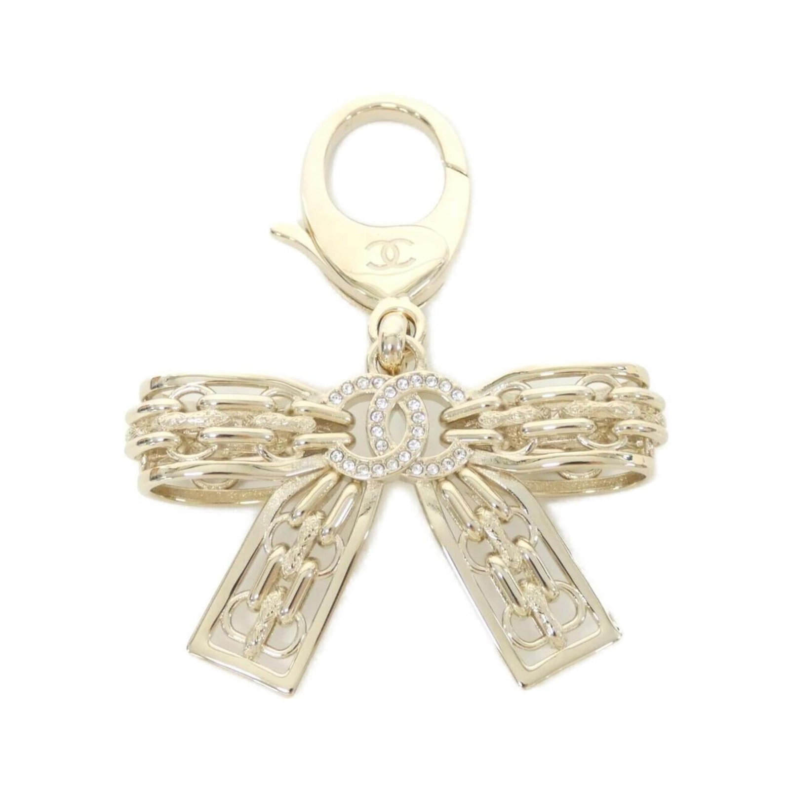 Keyring by Chanel: Keyring by Chanel Gold Keyring by Chanel. This elegant keyring features the iconic design of Chanel, adding a touch of luxury to any outfit. Made from high-quality materials, it showcases the brand's 