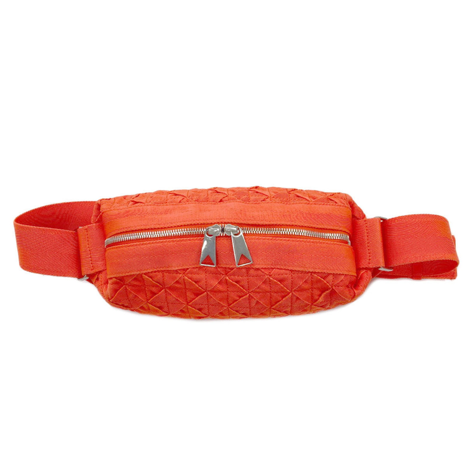 Canvas sling bag by Veneta: Canvas sling bag by Veneta Canvas sling bag by Bottega Veneta, featuring a vibrant orange canvas material and a sleek, compact design. This stylish bag measures 12cm x 28cm x 9.5cm, making it the perf
