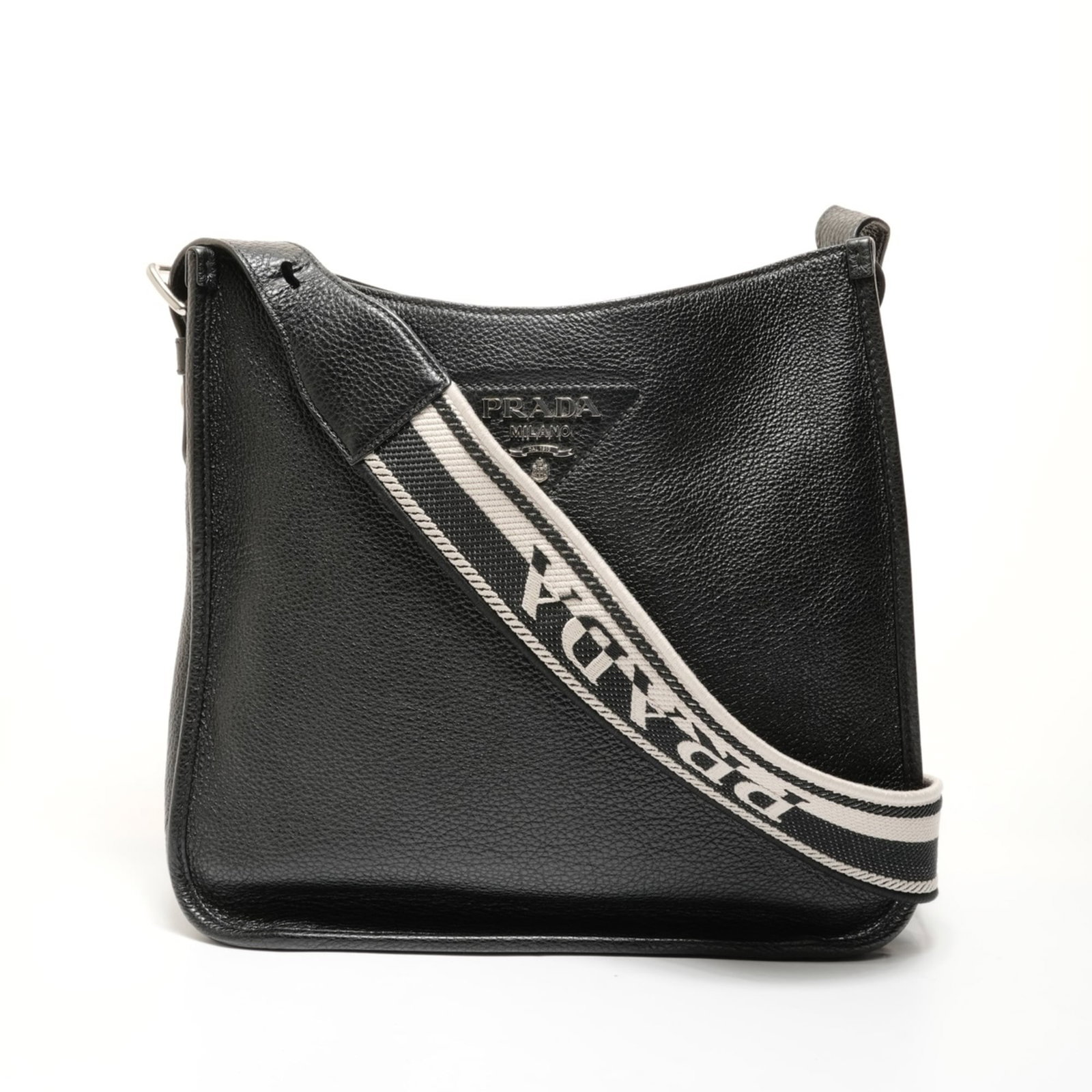 Shoulder Bag Leather by Prada: Shoulder Bag Leather by Prada Prada's sleek shoulder bag boasts a timeless design, crafted from high-quality black leather. Measuring 26cm x 29cm x 13cm, the spacious interior and adjustable strap