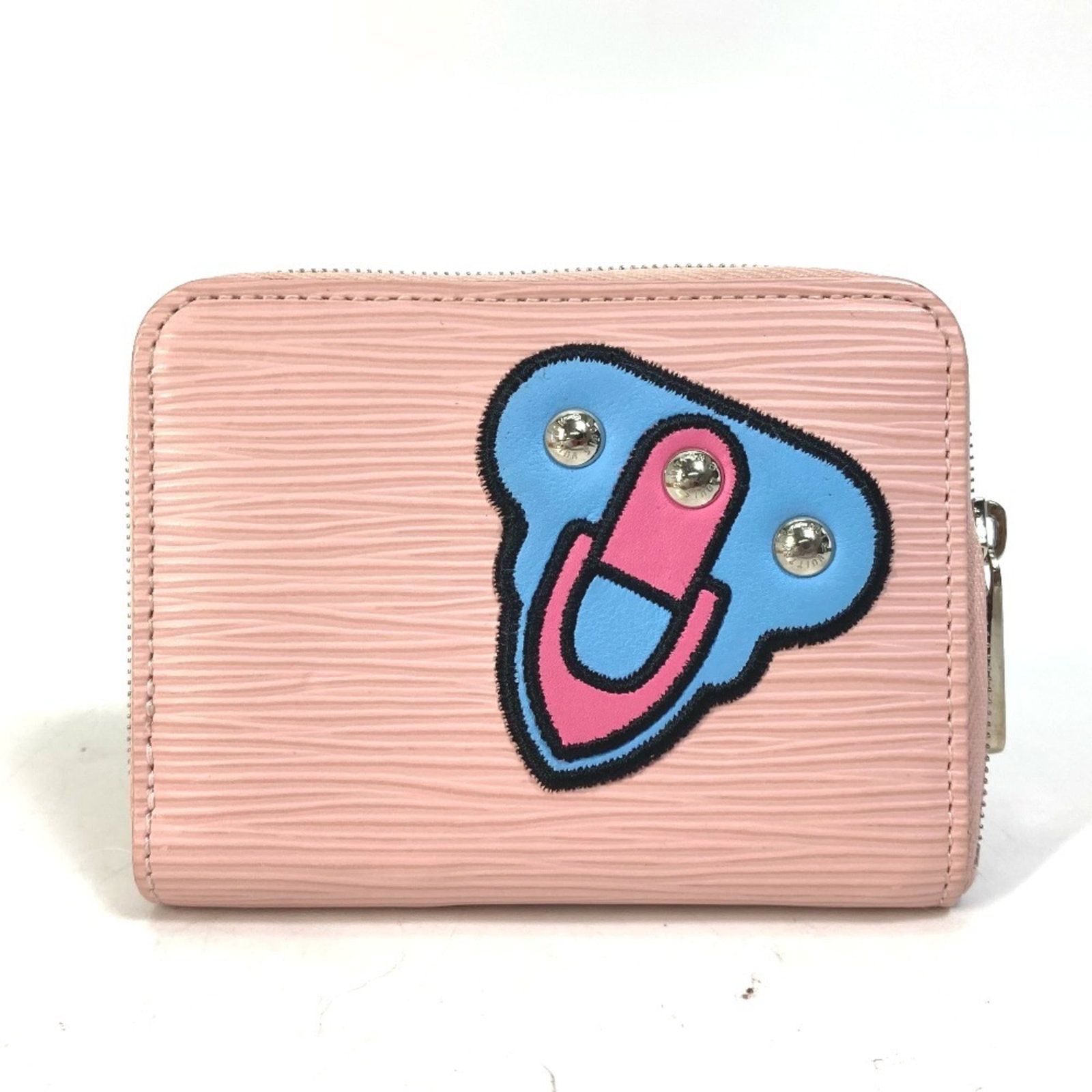 Louis Vuitton Epi Leather Coin Purse: Louis Vuitton Epi Leather Coin Purse The Louis Vuitton Epi Leather Coin Purse is a stylish and compact accessory, featuring the iconic Epi leather material in a vibrant pink hue. This elegant coin