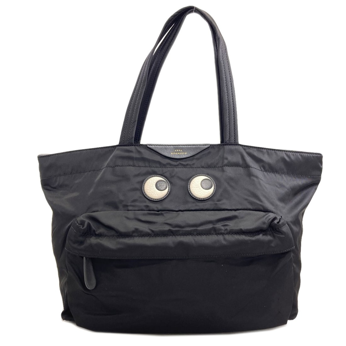 Anya Hindmarch Eyes Nylon Tote Bag: Anya Hindmarch Eyes Nylon Tote Bag Black nylon tote bag from Anya Hindmarch, featuring a sleek and modern design. Made from high-quality nylon, this tote bag boasts a durable exterior that's perfect