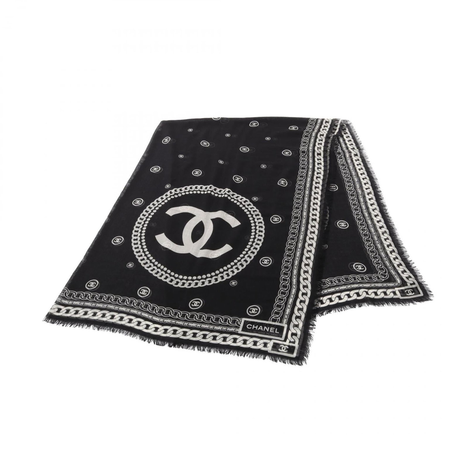 Silk cashmere shawl by Chanel: Silk cashmere shawl by Chanel Silk and cashmere blend in luxurious softness, forming the foundation of this elegant shawl. Measuring 1.86m x 1.32m, it boasts a striking black and white color palette.