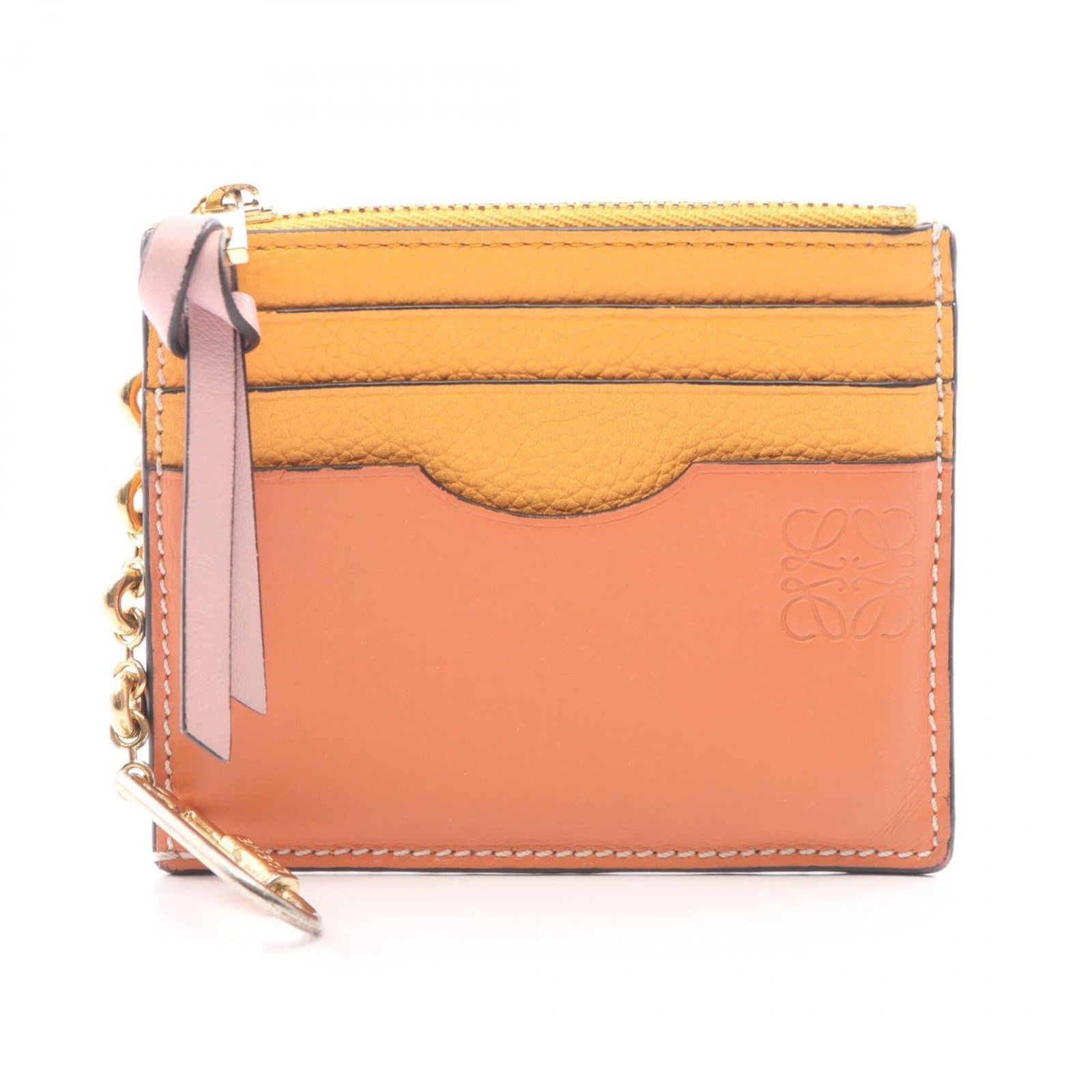 Coin Case Leather Purse Loewe: Coin Case Leather Purse Loewe This luxurious leather coin purse from Loewe boasts a rich brown, orange, and pink color combination. Made from high-quality leather, it measures 8.5cm x 10.5cm x 1.5cm i