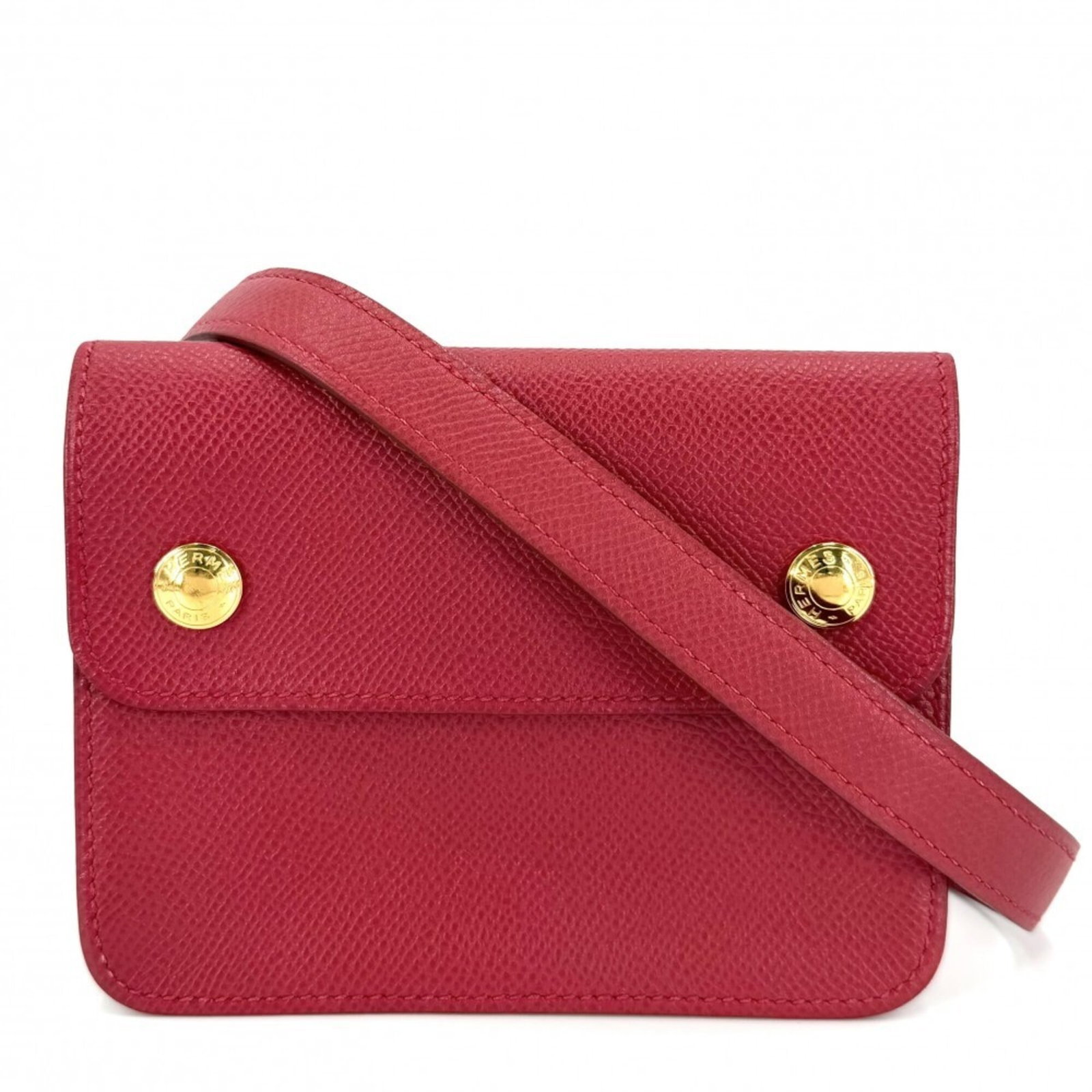 Fanny pack pochette leather by Hermes: Fanny pack pochette leather by Hermes This iconic Herm?s fanny pack pochette is crafted from rich, supple leather in a bold red color. Measuring just 10cm x 13.5cm x 3cm, it makes for a stylish and co