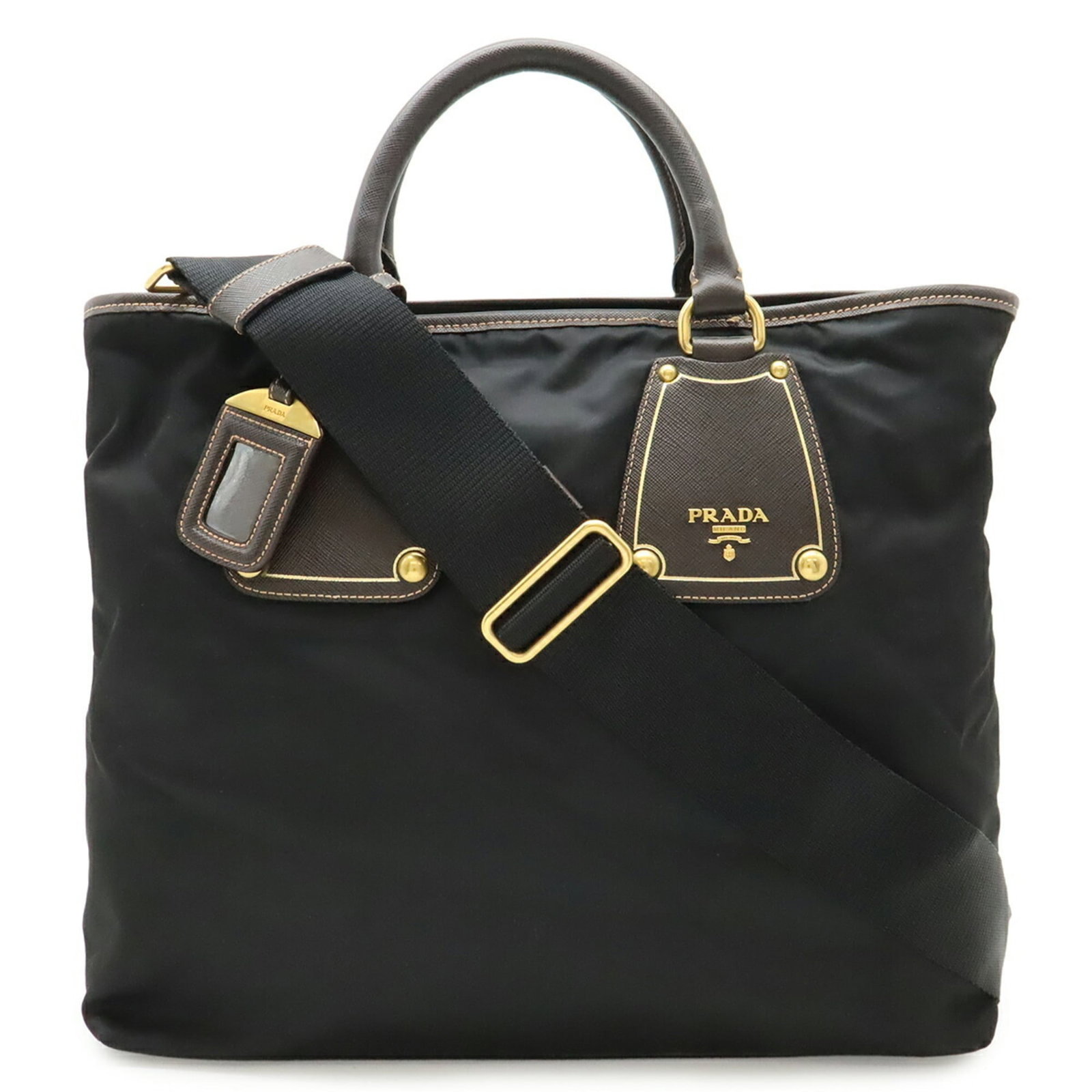 Nylon Leather Prada Tote Bag: Nylon Leather Prada Tote Bag Nylon and leather blend in this sleek Prada tote bag, available in black, dark brown, and Nero. The bag measures 32cm x 34.5cm x 13cm and weighs 720g, with a strap length
