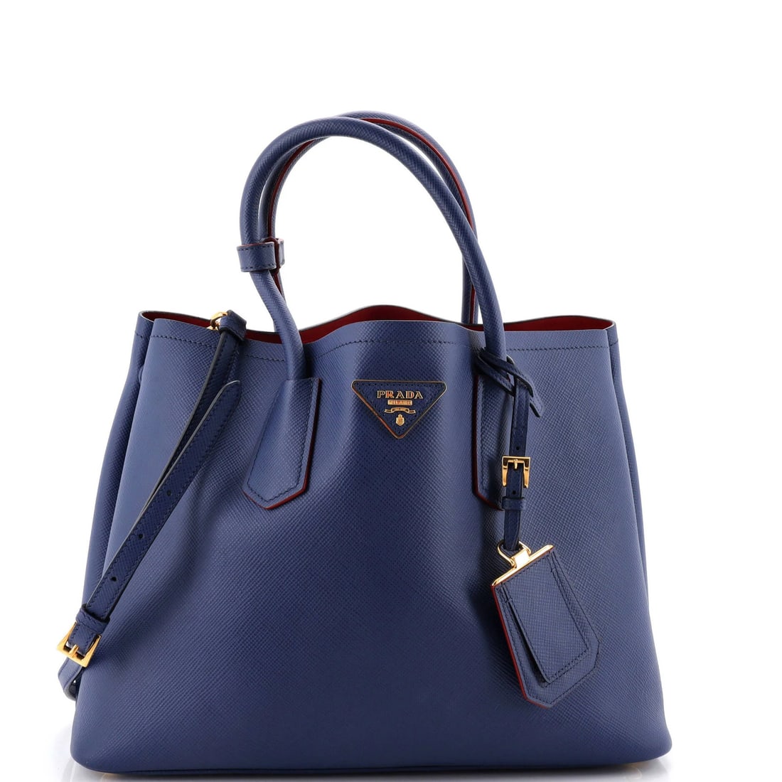 Saffiano Leather Double Cuir Tote Medium: Saffiano Leather Double Cuir Tote Medium Saffiano Leather Double Cuir Tote Medium for everyday essentials, featuring blue exterior and red interior. With gold hardware and Poignet luggage tag, this
