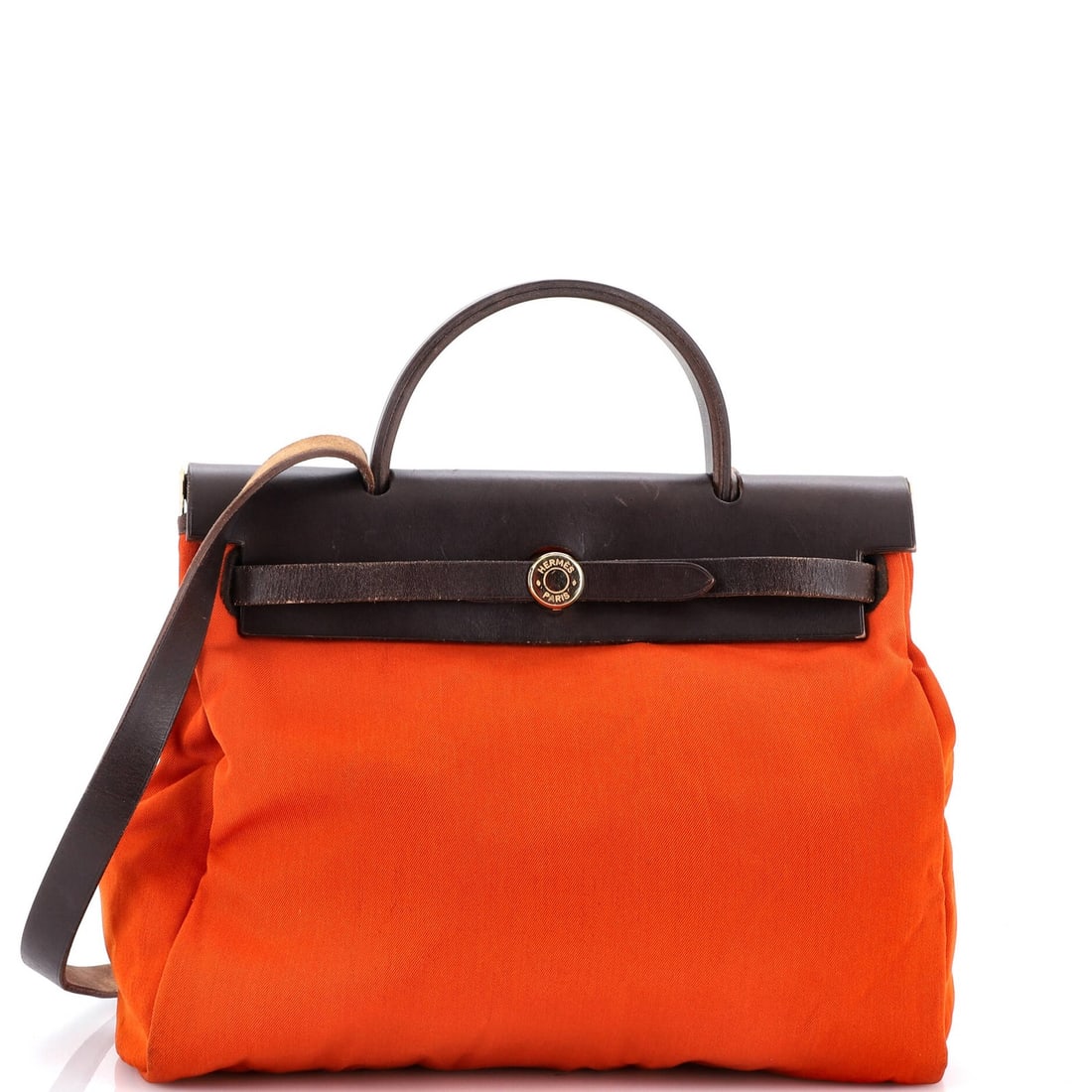 Toile Herbag Hermes Leather: Toile Herbag Hermes Leather This vibrant orange Herm?s Herbag Toile features a striking canvas and leather design, complete with a gold lock and leather stopper. The stylish top handle and extra bag