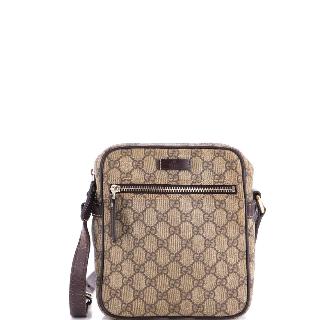 Front Zip Messenger Coated Small GG Canvas Gucci: Front Zip Messenger Coated Small GG Canvas Gucci Small GG Canvas Gucci Front Zip Messenger Bag in Brown. This small messenger bag features a front zip closure, canvas coated exterior with brown