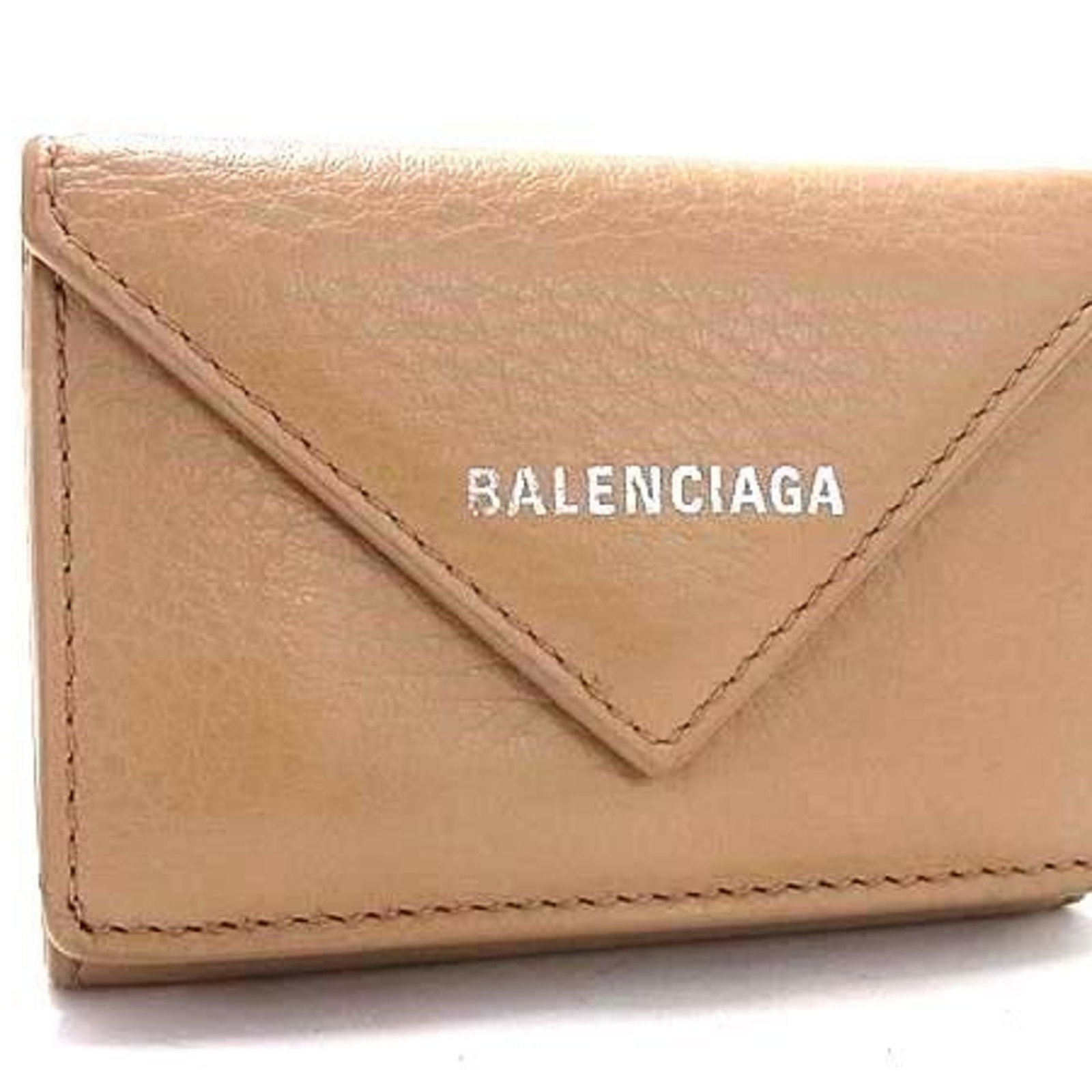 Balenciaga Wallet (Tri-Fold) Leather: Balenciaga Wallet (Tri-Fold) Leather Tri-fold leather wallet from Balenciaga, made in Italy with beige color and compact dimensions. The classic tri-fold design provides multiple compartments for