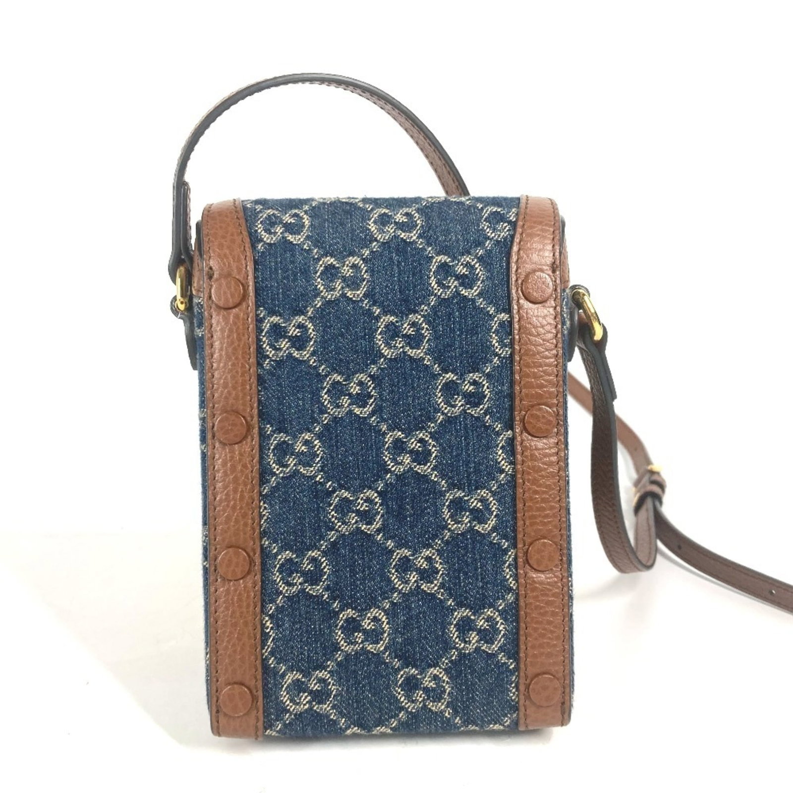 Pochette leather bag denim shoulder by Gucci: Pochette leather bag denim shoulder by Gucci Denim and leather come together in a classic Gucci design, the Horsebit Pochette shoulder bag. This iconic style features a blue and brown color