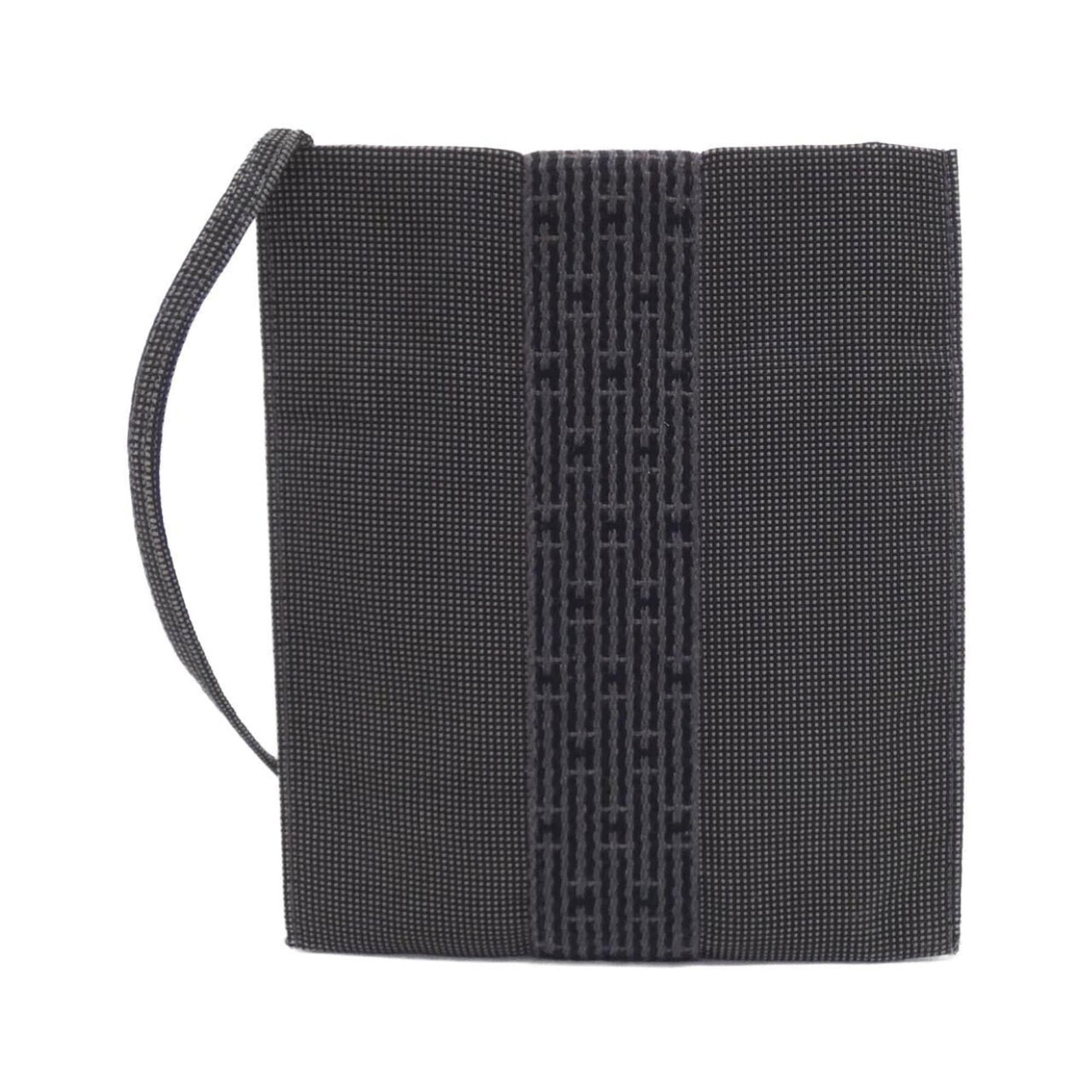 Hermes Pochette Shoulder Bag Canvas: Hermes Pochette Shoulder Bag Canvas Canvas Pochette Shoulder Bag by Hermes in Black. This classic shoulder bag features a timeless design and durable canvas material, measuring 19.5cm x 17cm x 1cm. Wi
