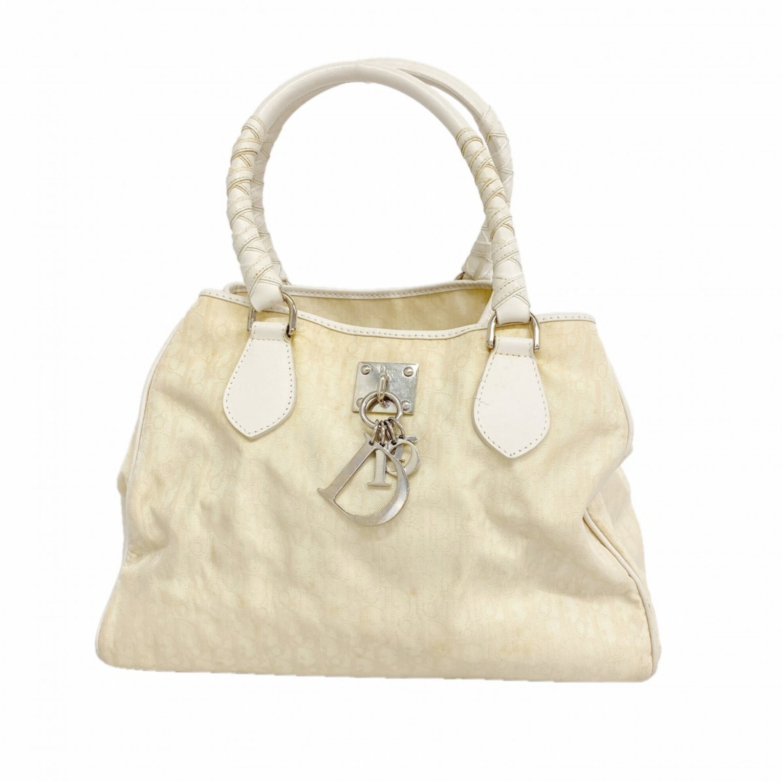 Canvas by Dior Christian: Canvas by Dior Christian Canvas by Dior Christian, a beige canvas handbag with dimensions of 23cm x 32.5cm x 12cm. This bag bears a signature and is made from canvas material. The exact origin of the 