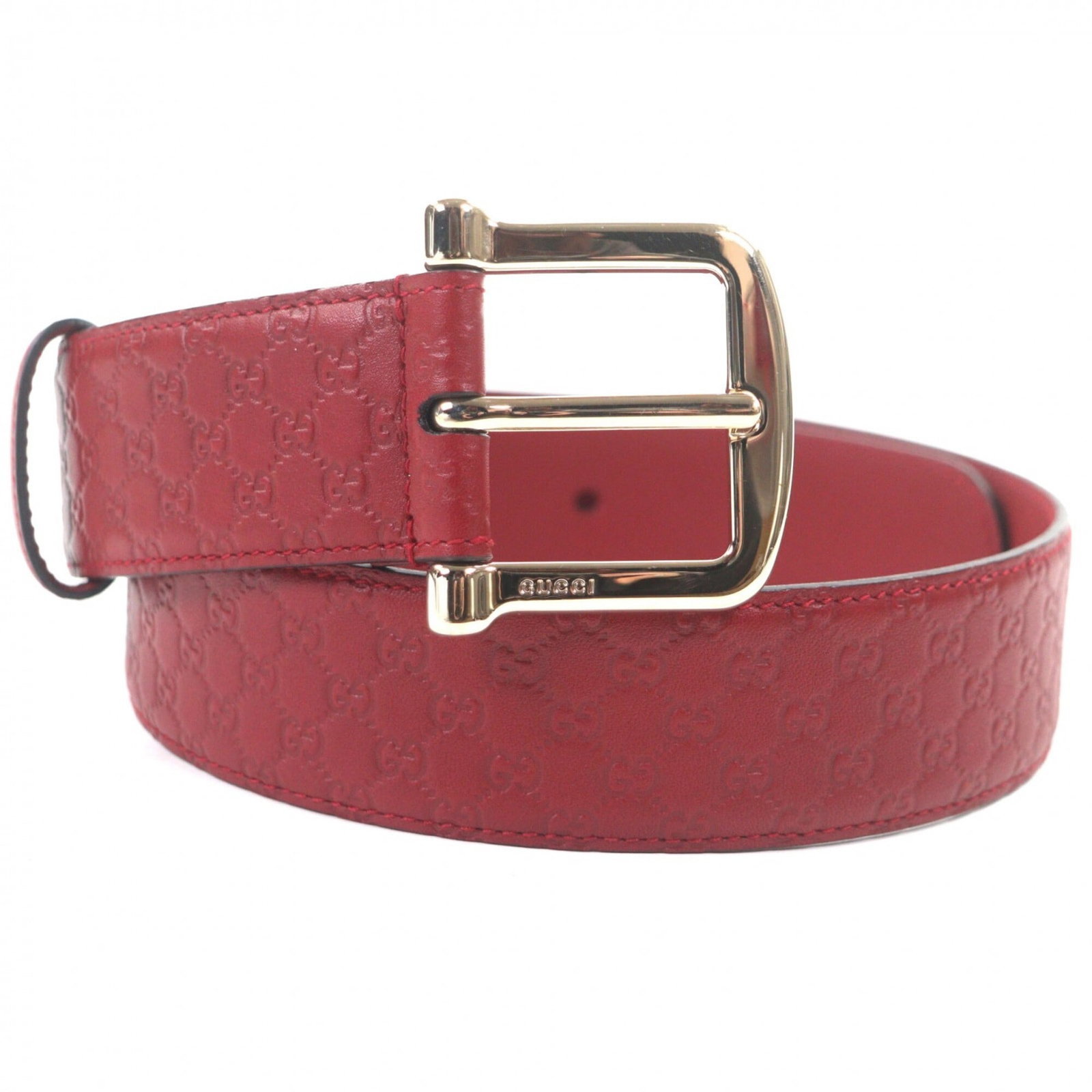 Standard Belt Gucci: Standard Belt Gucci This standard Gucci belt features a striking red color and is made from high-quality leather. Measuring 76.5cm in length, it provides a classic and timeless look for men. The signa