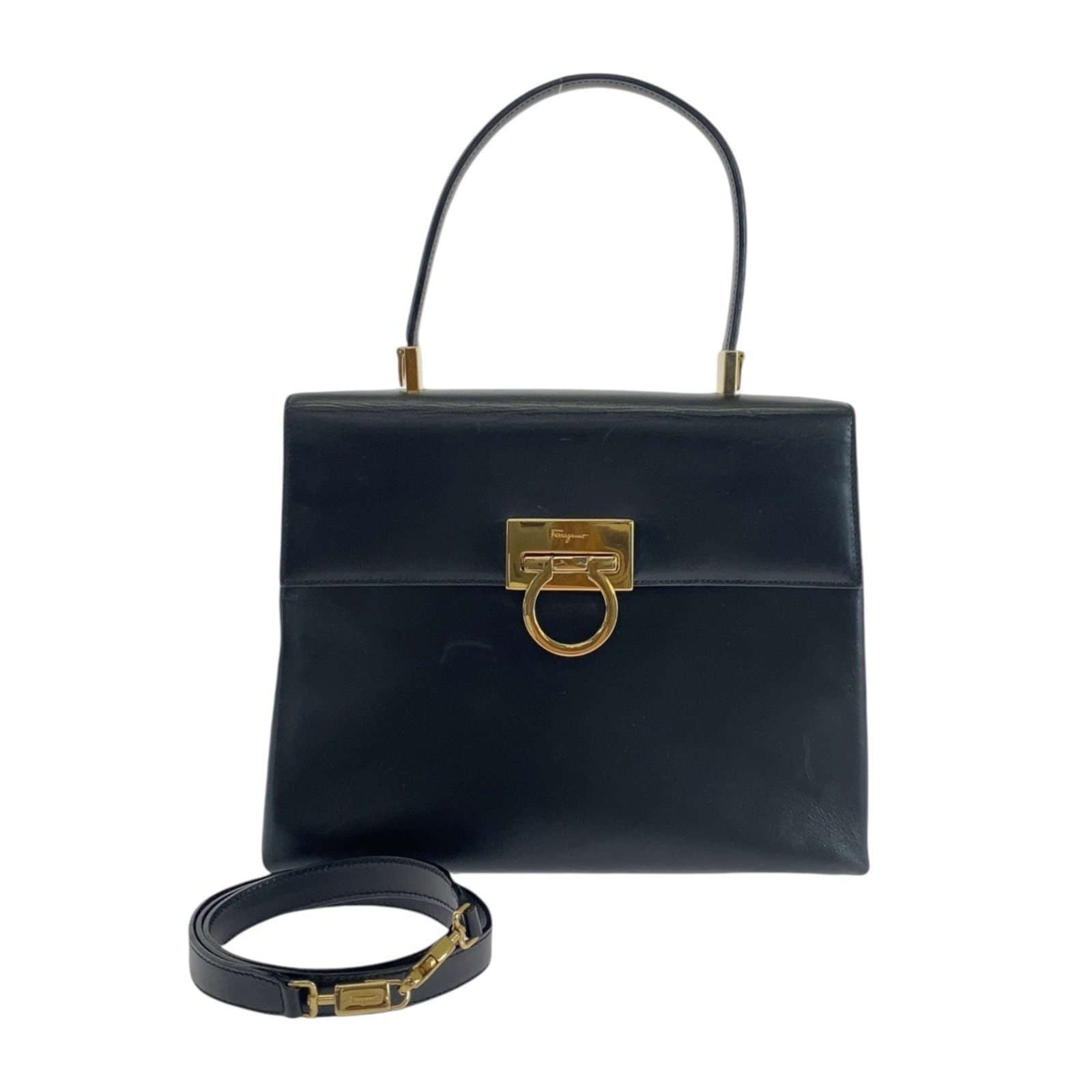 Handbag Salvatore Ferragamo Leather Shoulder: Handbag Salvatore Ferragamo Leather Shoulder This black leather shoulder bag from Salvatore Ferragamo features gold hardware, showcasing the iconic Italian brand's signature style. Made from