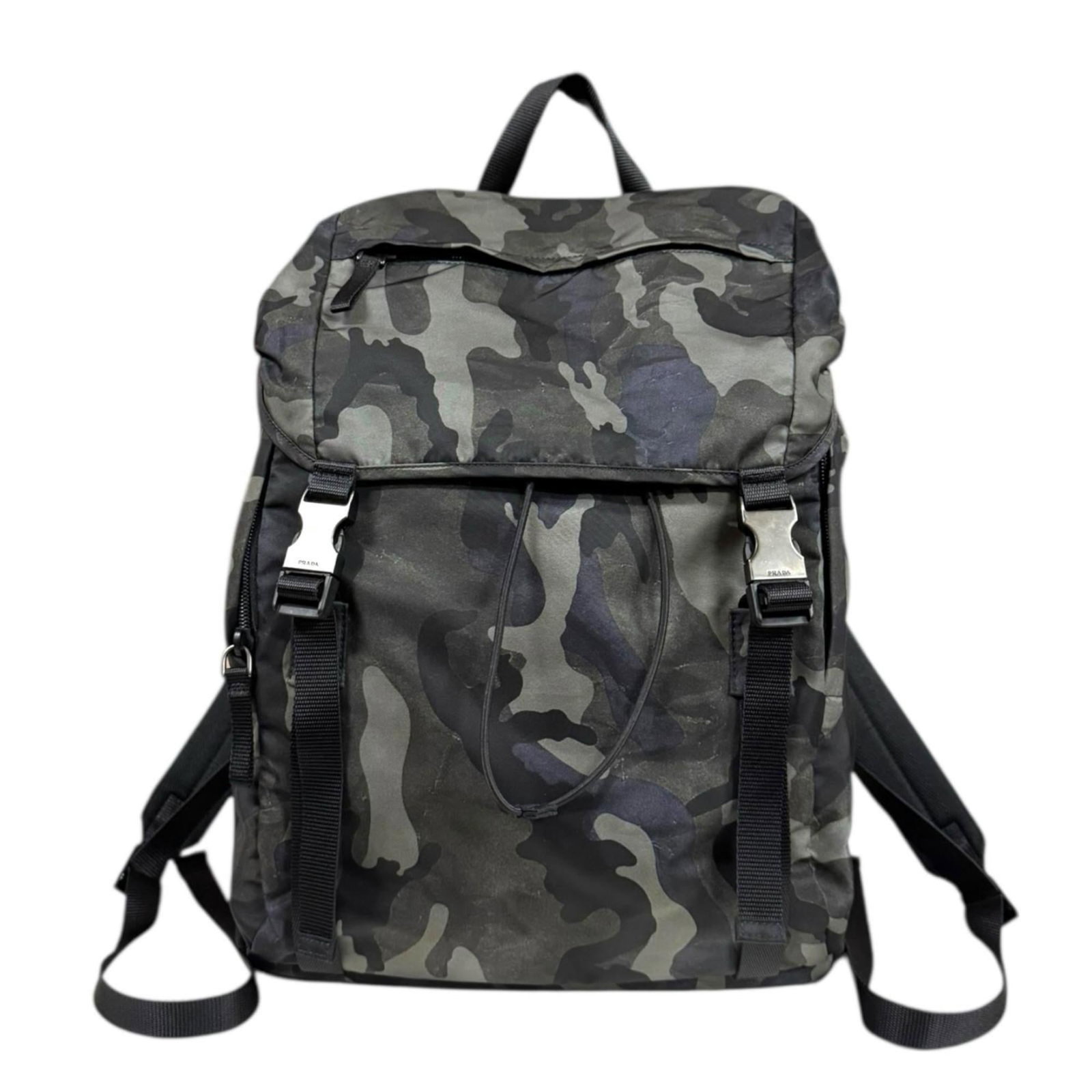 Backpack nylon by Prada: Backpack nylon by Prada Black and green nylon backpack by Prada, measuring 42cm x 30cm x 15cm. This stylish backpack features a sleek design made from high-quality nylon material. Item Specifics: