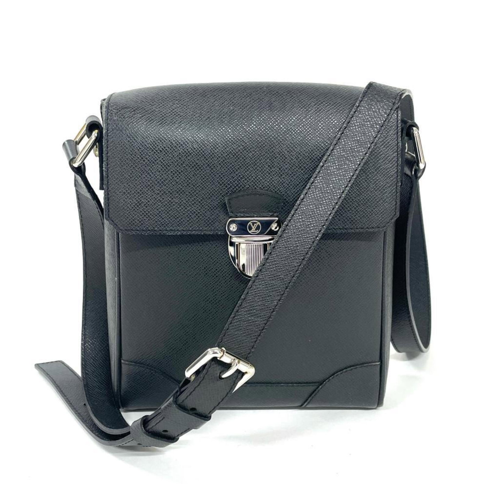 Taiga Leather Shoulder Bag by Louis Vuitton: Taiga Leather Shoulder Bag by Louis Vuitton Taiga Leather Shoulder Bag by Louis Vuitton - A sleek and sophisticated accessory, this black shoulder bag features high-quality Taiga leather construction.