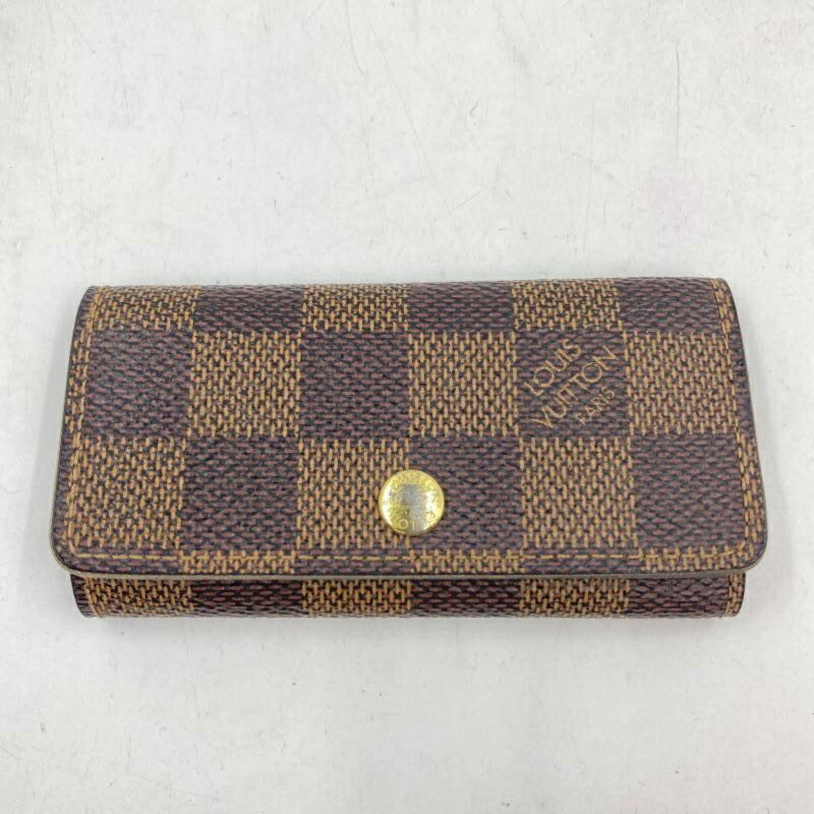 Damier canvas keycase by Louis Vuitton: Damier canvas keycase by Louis Vuitton Damier canvas by Louis Vuitton, a classic design featuring iconic geometric patterns. Made from high-quality Damier canvas, this compact keycase measures just 5.
