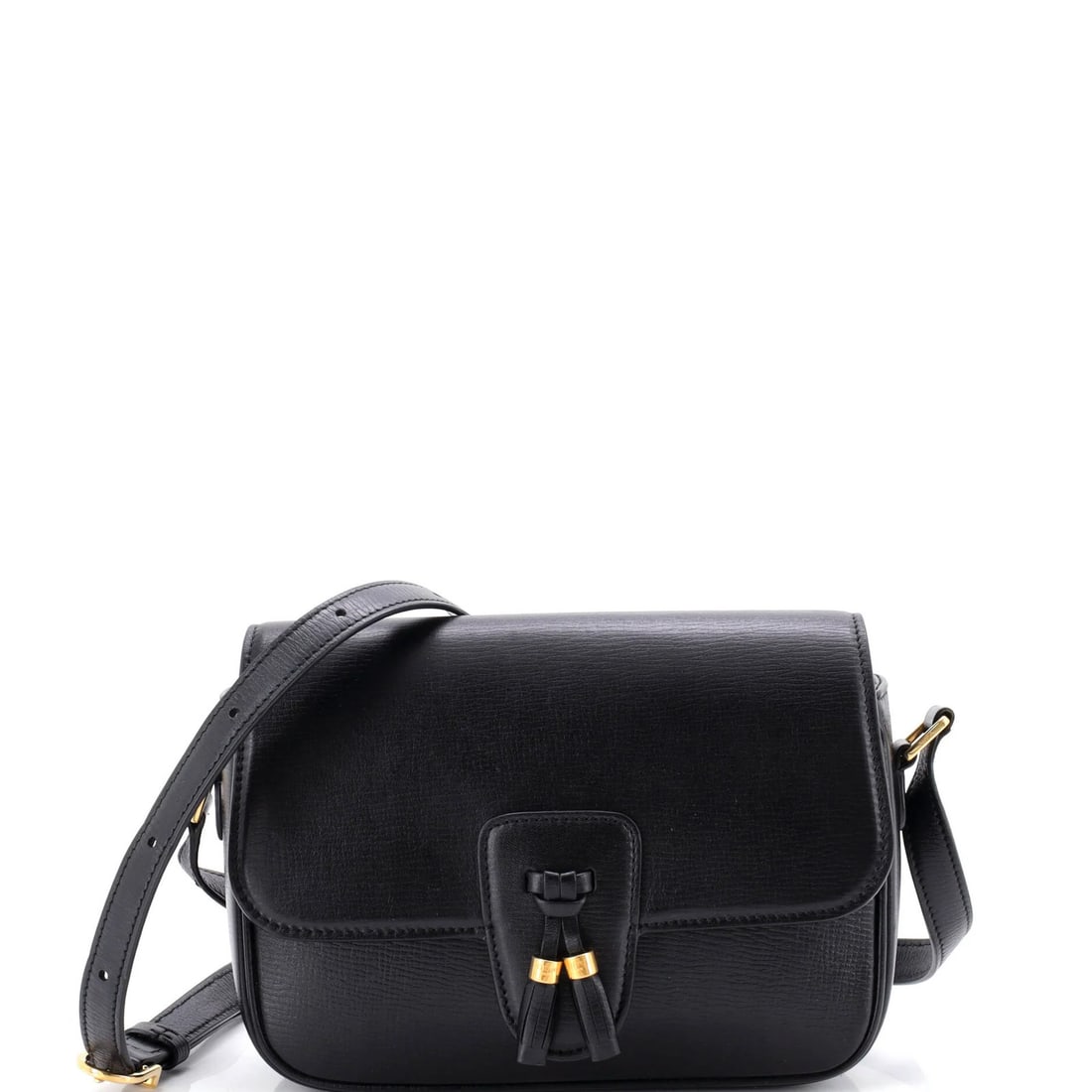 Leather medium bag tassels by Celine: Leather medium bag tassels by Celine Black leather medium bag tassels by Celine, featuring gold hardware and a classic design. The exterior shows signs of wear, including heavy corner wear, scuffs,