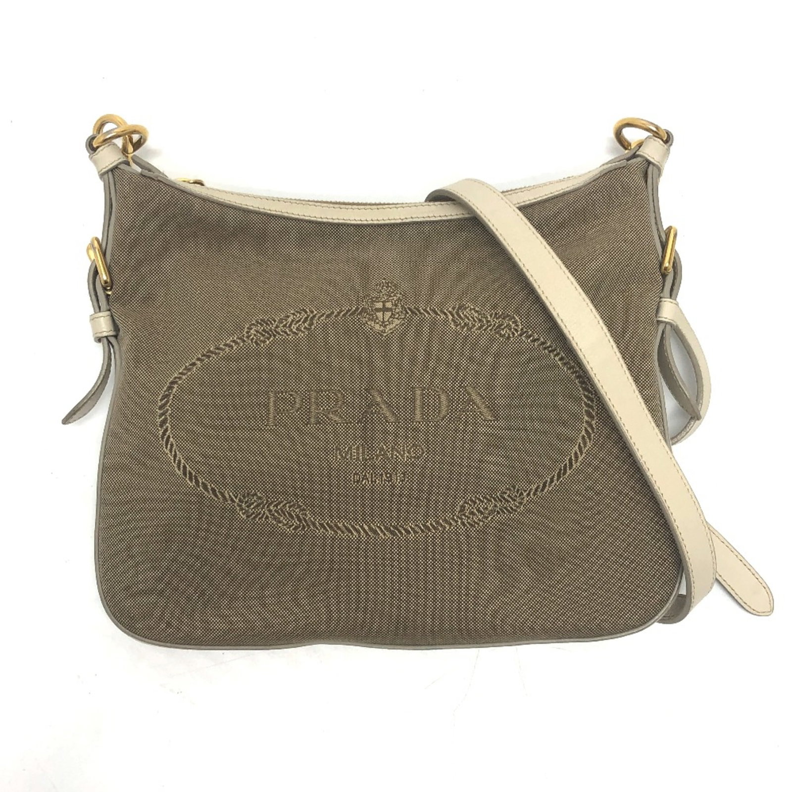 Prada Bag Shoulder: Prada Bag Shoulder Beige Prada Shoulder Bag with Classic Design. This shoulder bag features a timeless design, measuring 27.5cm x 22.5cm x 2cm in size. Its neutral beige color adds a touch of