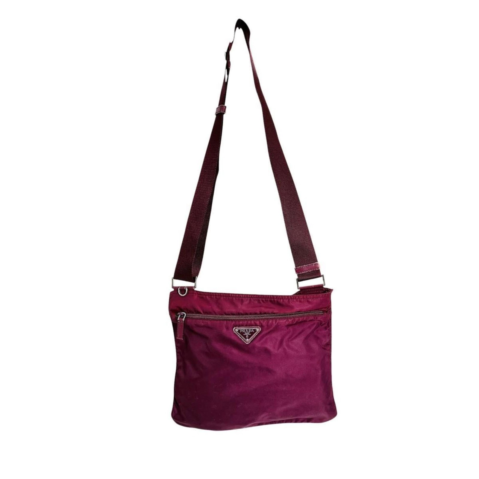 Shoulder Bag Nylon Prada: Shoulder Bag Nylon Prada Nylon Prada shoulder bag in wine color, featuring a zipper closure and adjustable strap length from 68cm to 123cm. Made from durable nylon material with a compact size of 25cm