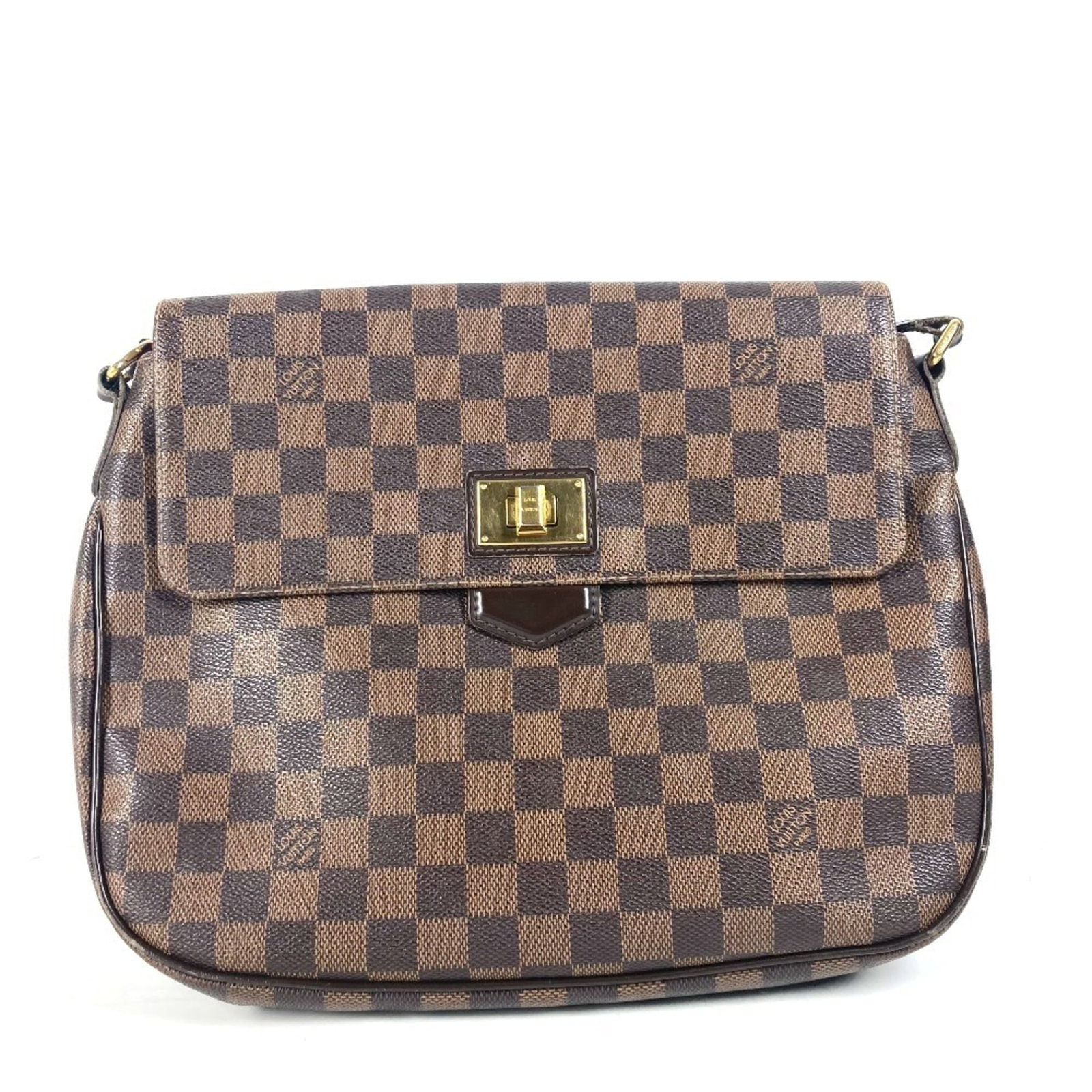 Shoulder Bag Damier Canvas by Louis Vuitton: Shoulder Bag Damier Canvas by Louis Vuitton Damier Canvas by Louis Vuitton, a classic shoulder bag with timeless style. Made from high-quality Damier Canvas in brown and featuring an Ebene closure,