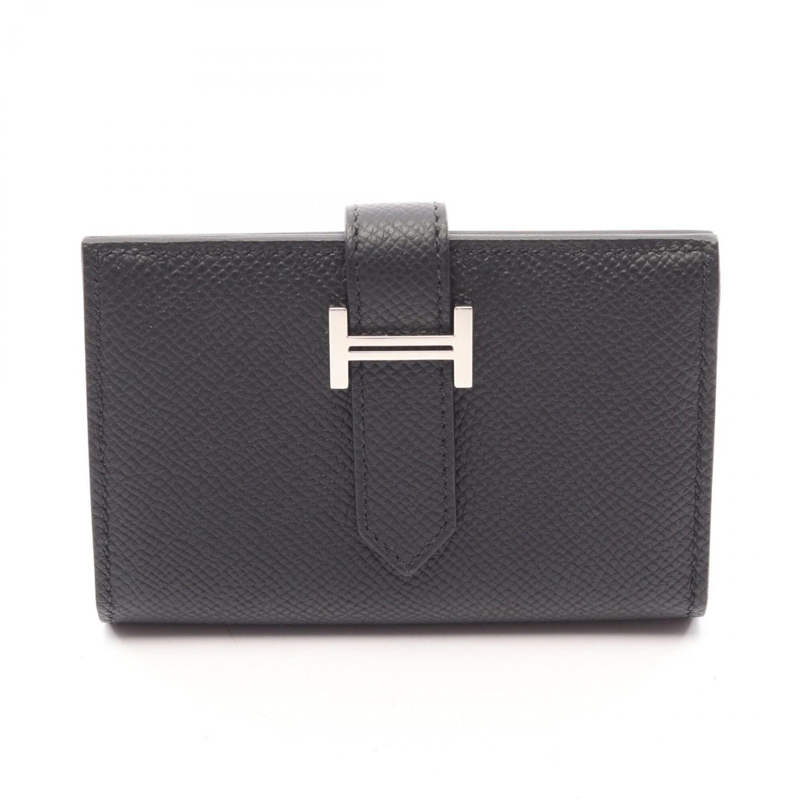 Hermes Card Case Epsom Leather: Hermes Card Case Epsom Leather Epsom leather card case from Hermes, crafted with attention to detail and precision. This sleek black case measures 7cm x 10cm x 2cm, making it a compact yet stylish