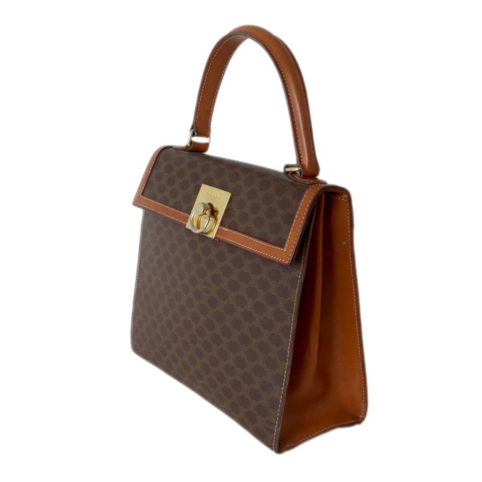 Handbag PVC Celine: Handbag PVC Celine The Celine handbag is made from PVC and leather, with a brown color. It measures 21cm x 23cm x 10cm and has no accessories. This bag bears a signature. Item Specifics: Brand: Celine