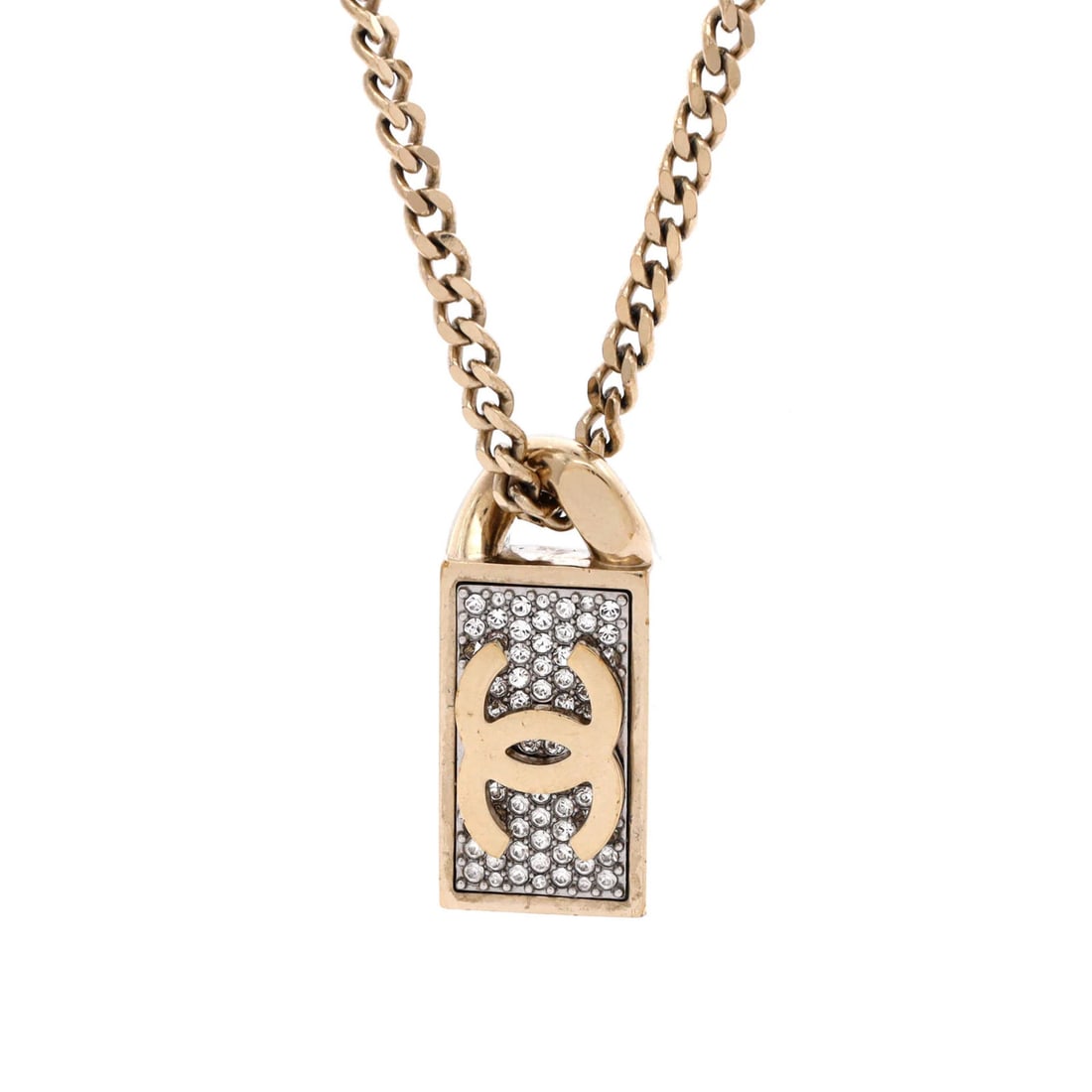 Chanel CC Dog Tag Pendant Necklace Metal with Crystals: Chanel CC Dog Tag Pendant Necklace Metal with Crystals Gold metal Chanel CC Dog Tag Pendant Necklace with crystals, featuring moderate scratches and wear throughout, dings and tarnish on the pendant. 