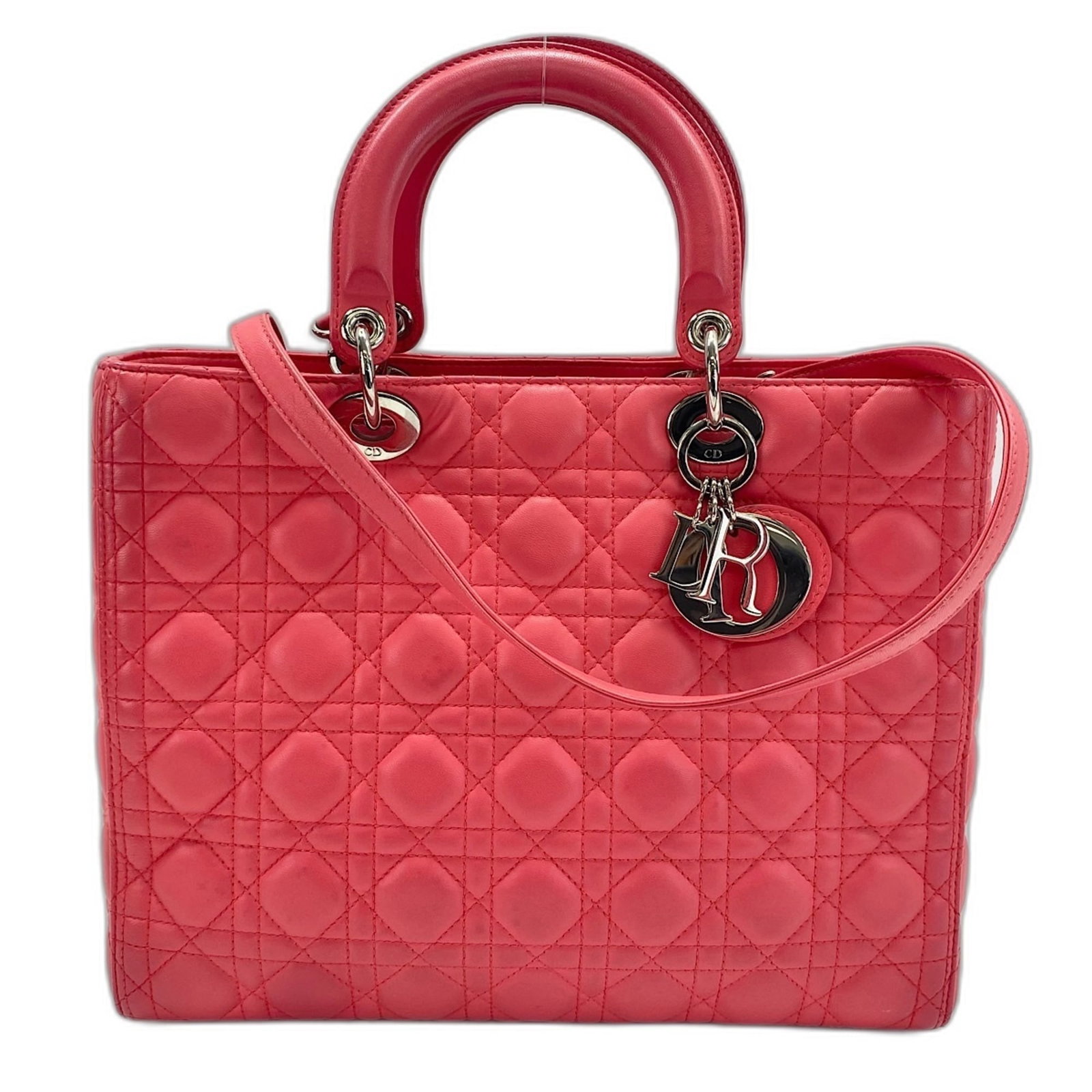 Handbag Christian Dior Leather: Handbag Christian Dior Leather This Christian Dior leather handbag boasts a striking pink hue, adding a pop of color to any outfit. Measuring 25cm x 32cm x 12cm, its compact size makes it perfect for