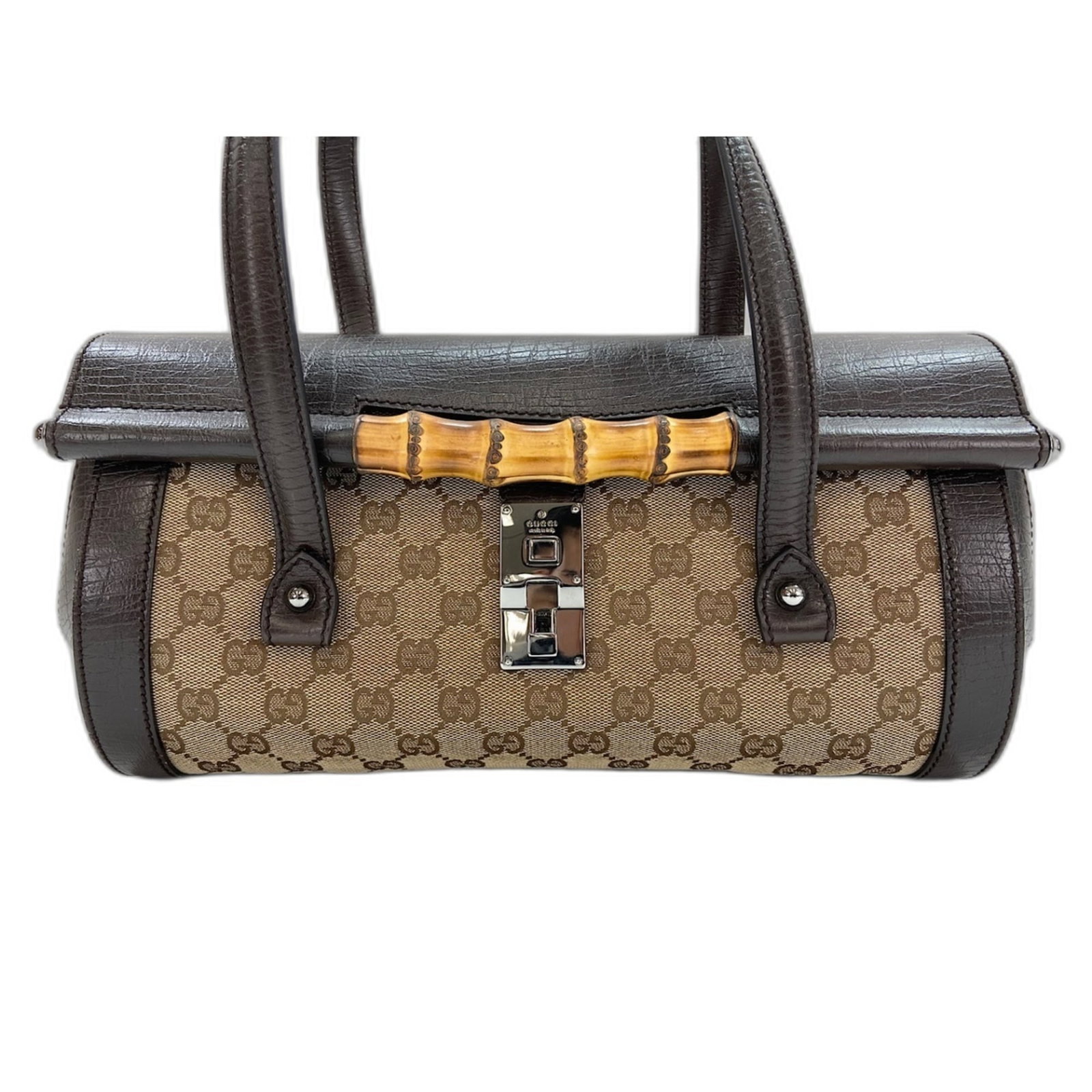 Handbag bamboo: Handbag bamboo The Gucci Handbag Bamboo features a unique bamboo material, showcasing the brand's innovative approach to luxury. Measuring 21cm x 30cm x 11cm, this handbag boasts a distinctive brown c
