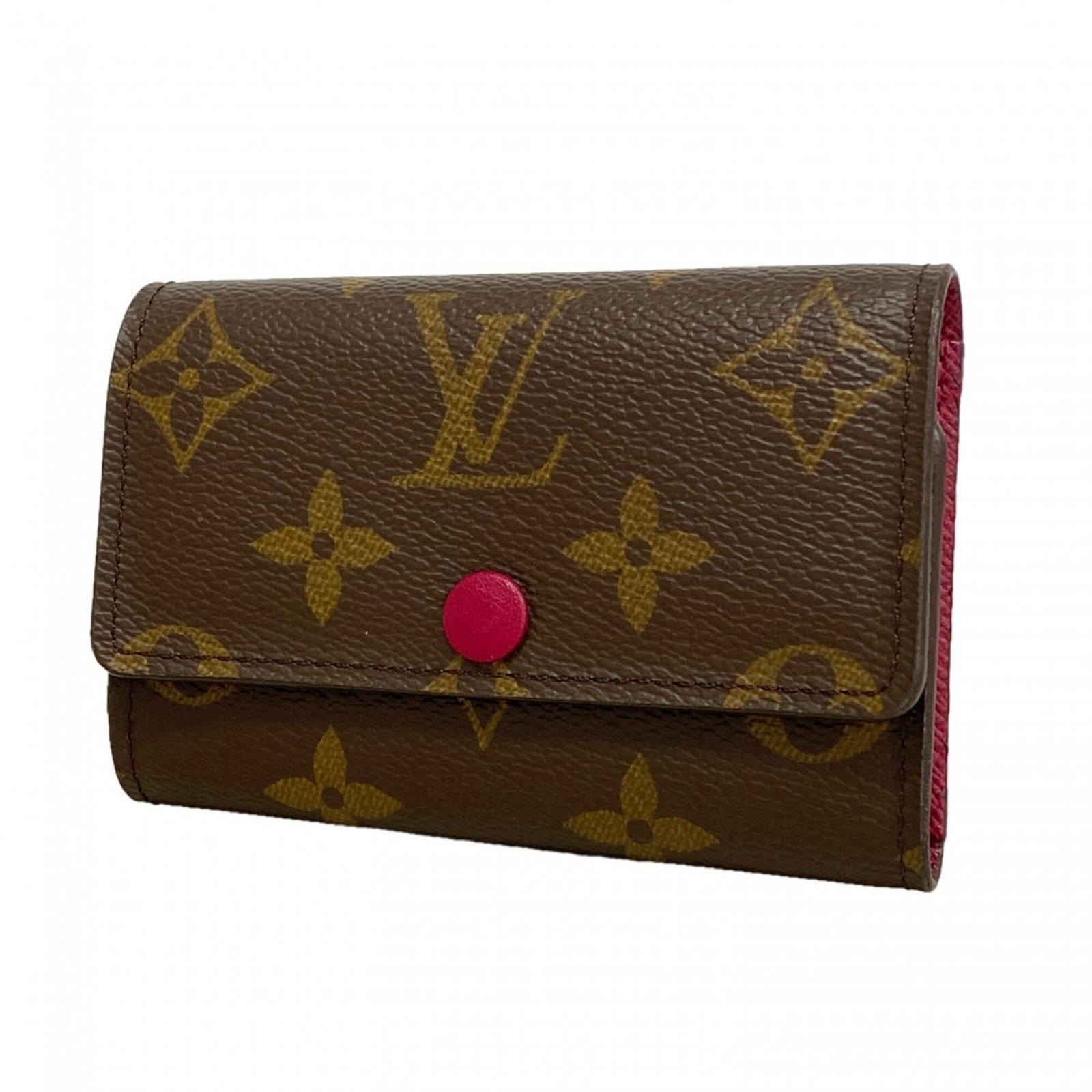 Keycase by Louis Vuitton: Keycase by Louis Vuitton Brown and Fuchsia Louis Vuitton Keycase. Made with precision, this compact keycase measures 7cm x 10.5cm x 1.5cm and features a classic design that complements any style. Perf