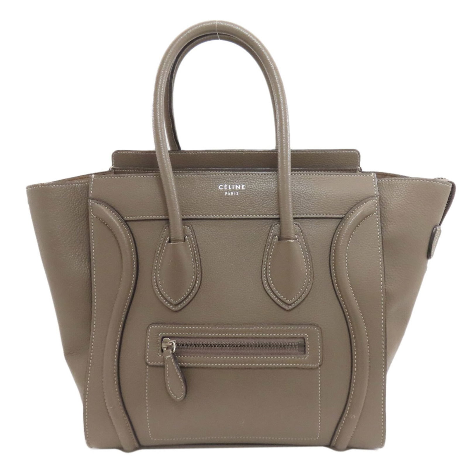 Handbag Celine Leather: Handbag Celine Leather Grayish Celine Leather Handbag. Made from high-quality calfskin leather, this handbag features a timeless design with clean lines and a classic shape. With its neutral grayish