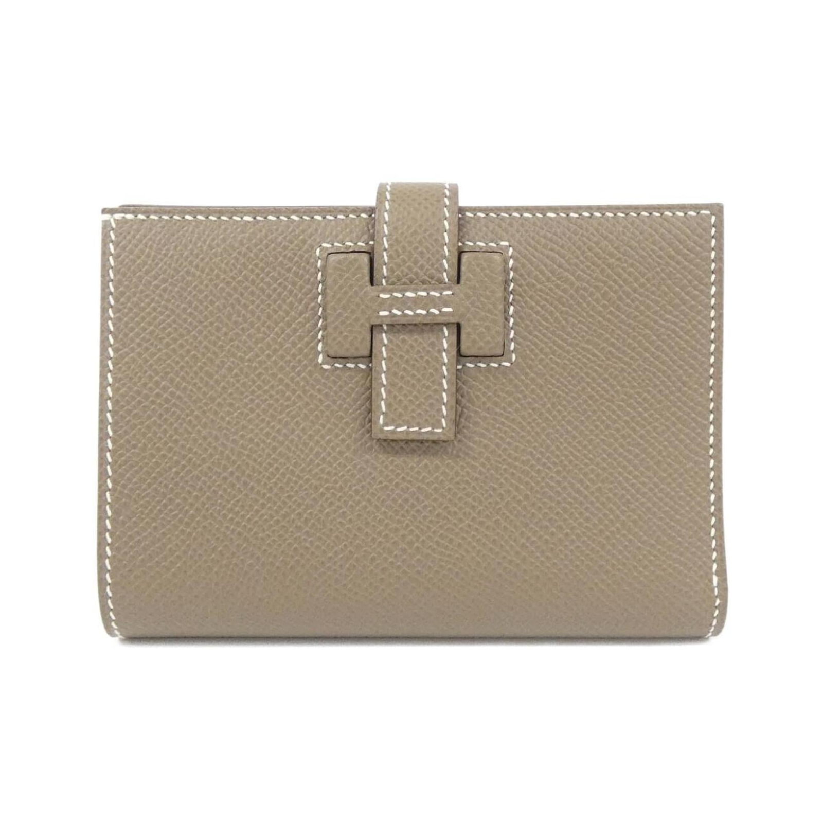 Epsom Leather Bi Fold Wallet Hermes: Epsom Leather Bi Fold Wallet Hermes Epsom Leather Bi Fold Wallet by Hermes, featuring high-quality Epsom leather in Etoupe gray. This bi-fold wallet measures 9cm x 12cm x 2cm and offers a sleek