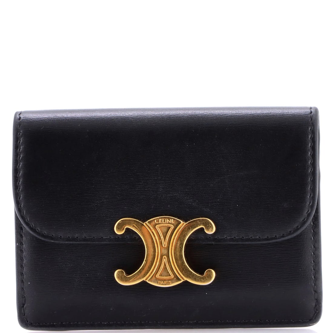 Celine Triomphe Card Case Leather: Celine Triomphe Card Case Leather Black leather Celine Triomphe Card Case, featuring gold hardware and a classic design. The exterior shows signs of wear with creases and scuffs, while the interior