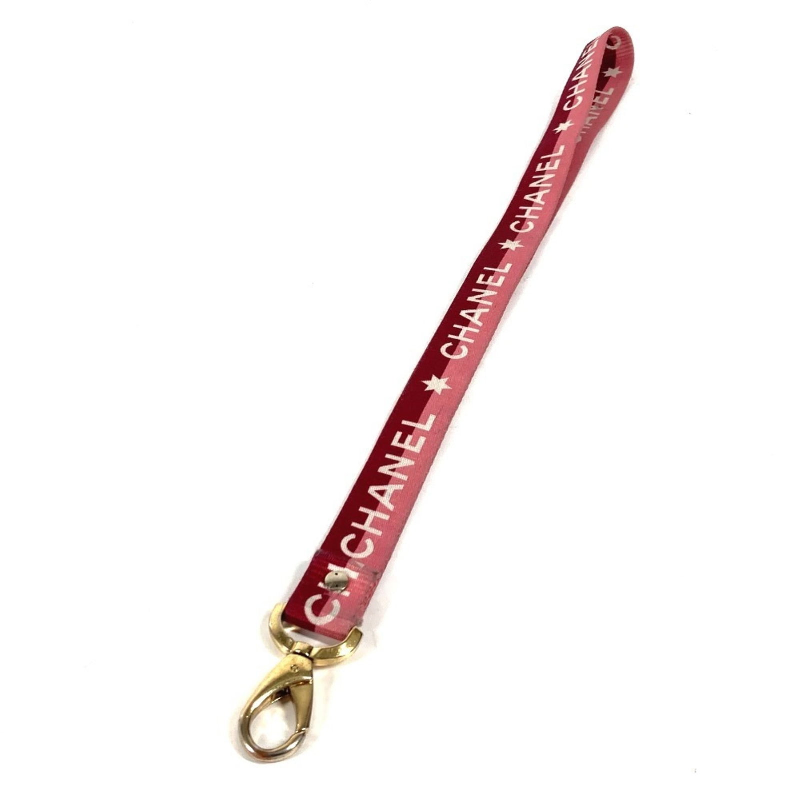 Canvas Chanel neck strap: Canvas Chanel neck strap Canvas Chanel neck strap in pink, made from canvas material with no additional accessories. This item bears a signature, but the authenticity of the signature cannot be confir