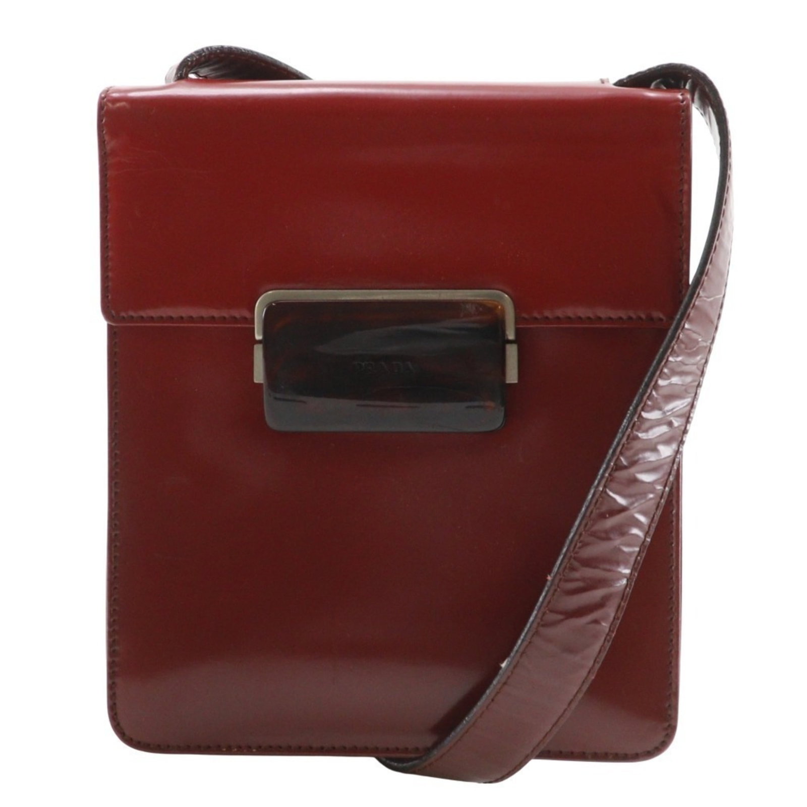 Shoulder Bag: Shoulder Bag Red Prada Shoulder Bag with Flap Closure. This stylish shoulder bag features a bold red color, zipper pocket and open pockets for organization, and a secure flap closure to keep its conte