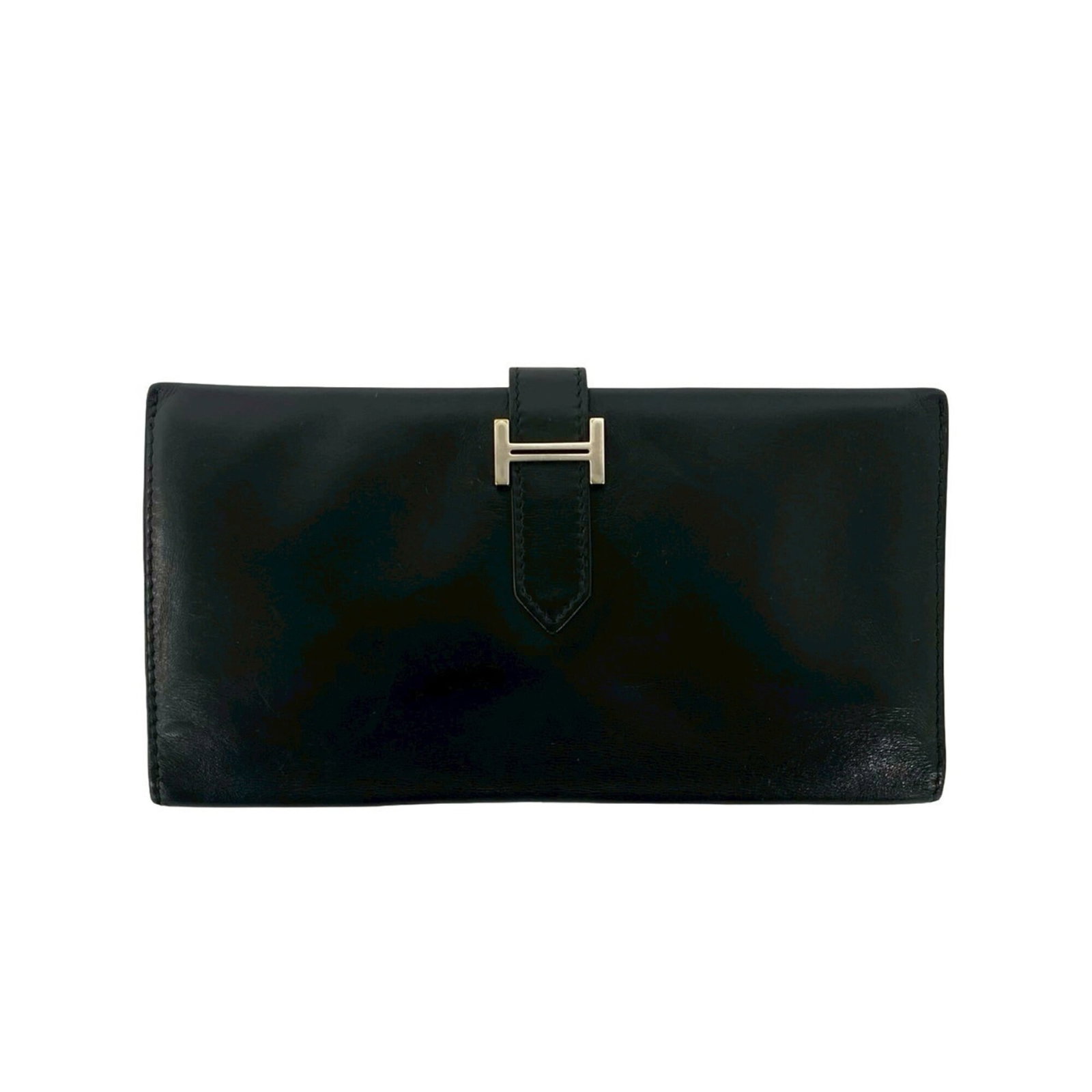 Calf leather wallet box bi-fold Hermes: Calf leather wallet box bi-fold Hermes Box calf leather, black in color, and measuring 9.5cm x 17.5cm, this bi-fold wallet box from Hermes features a classic design with clean lines and minimal