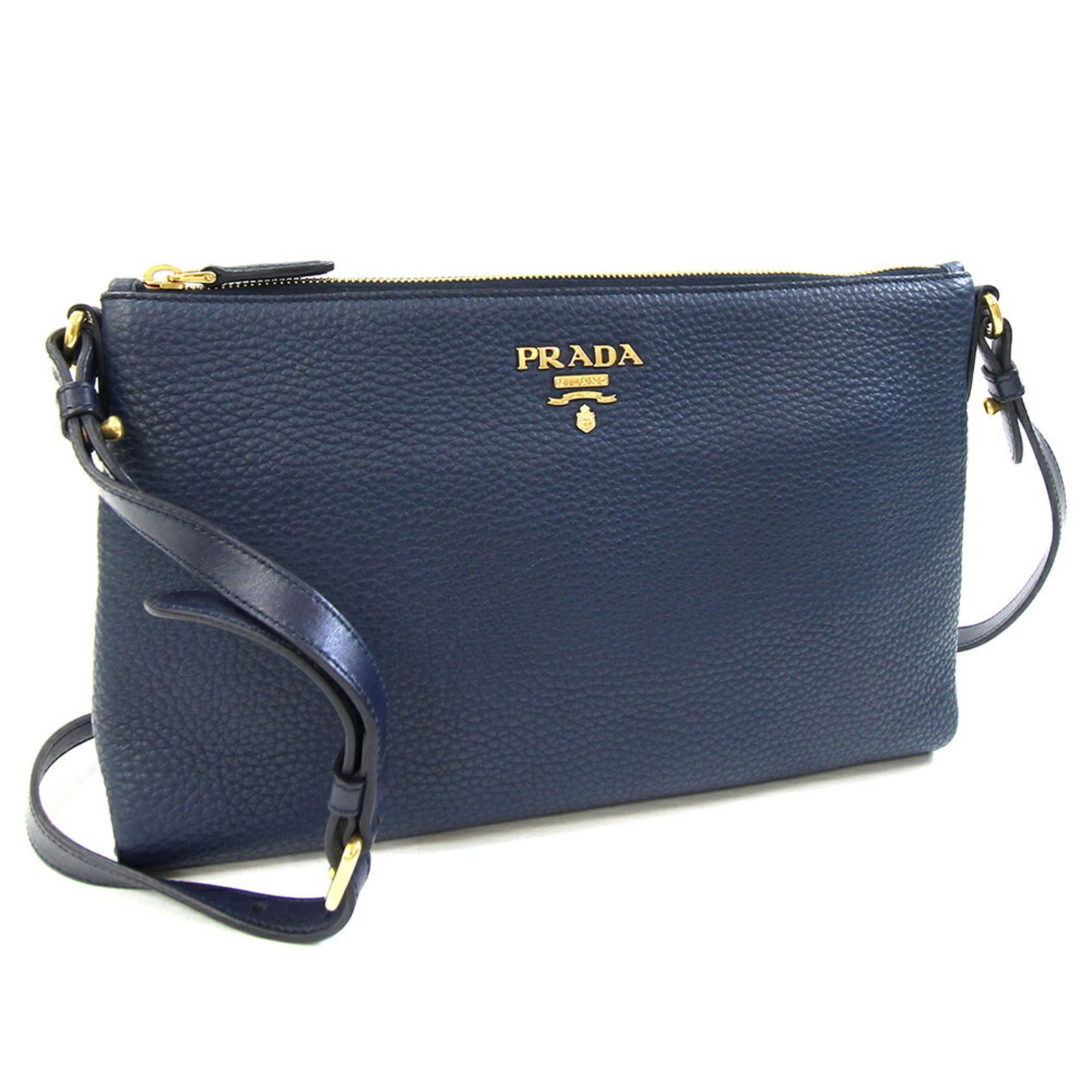 Shoulder Bag Leather by Prada: Shoulder Bag Leather by Prada Navy leather shoulder bag from Prada, measuring 18.5cm x 30cm x 3cm, features high-quality materials and a classic design. Made in Romania, this stylish accessory boasts