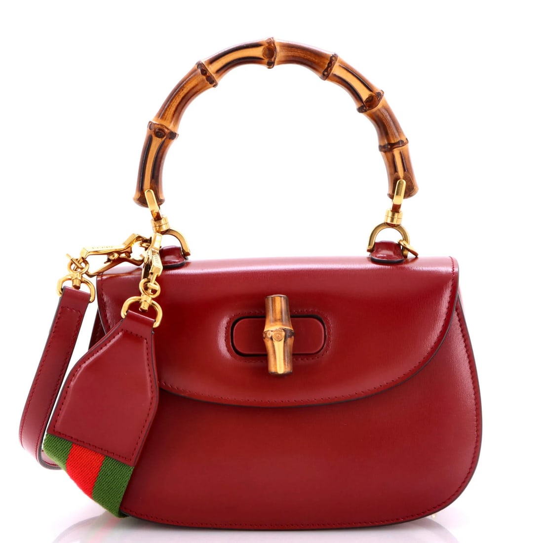 Gucci bamboo bag top handle leather small: Gucci bamboo bag top handle leather small Burgundy leather Gucci bamboo bag with top handle, featuring a small size and mirror case. The bag's exterior shows minor scuffs, creases, and edge wear,