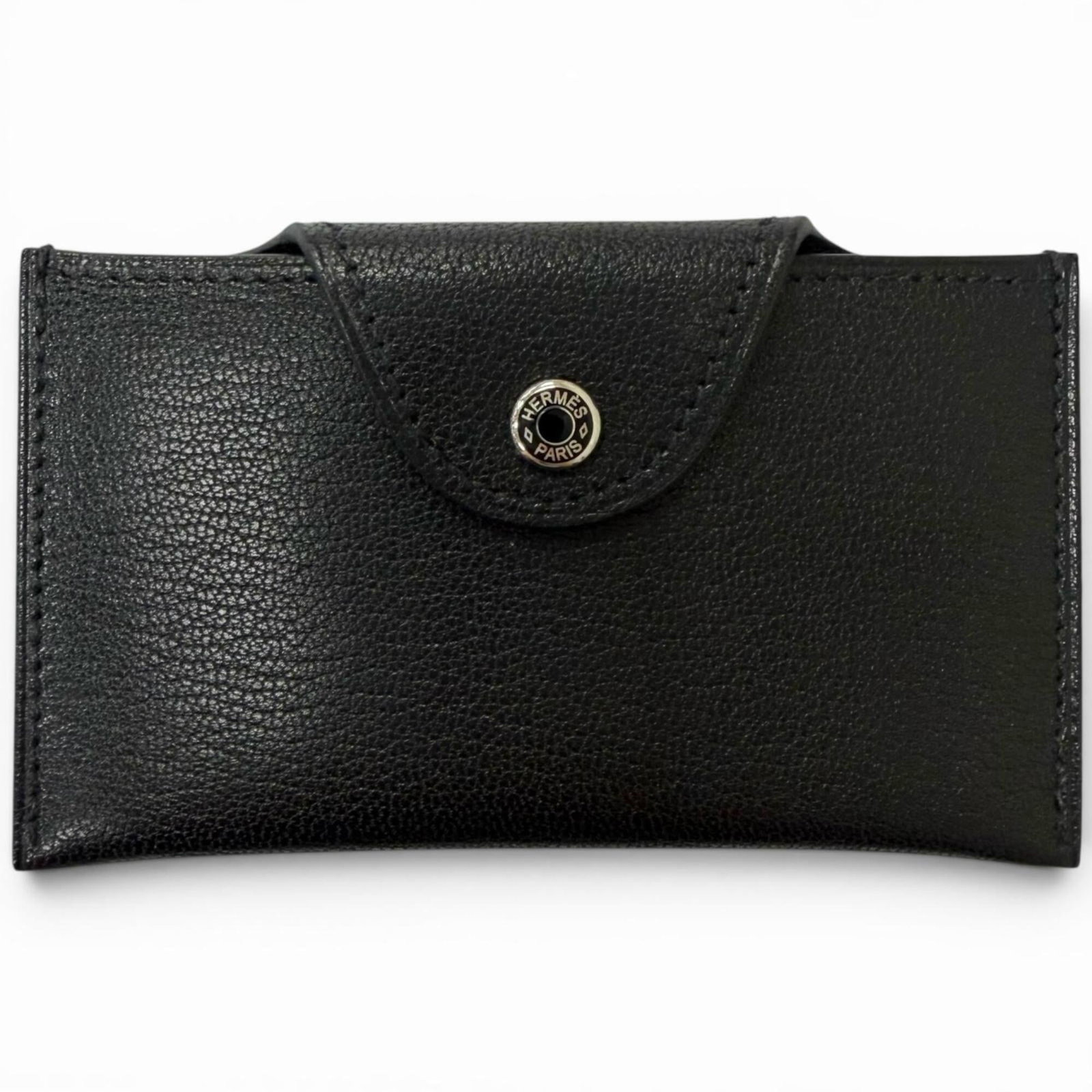 Chevre leather card case by Hermes: Chevre leather card case by Hermes Chevre leather card case by Hermes features high-quality, black chevre leather construction with precise dimensions. This compact card case measures 5.8cm x 10.5cm a