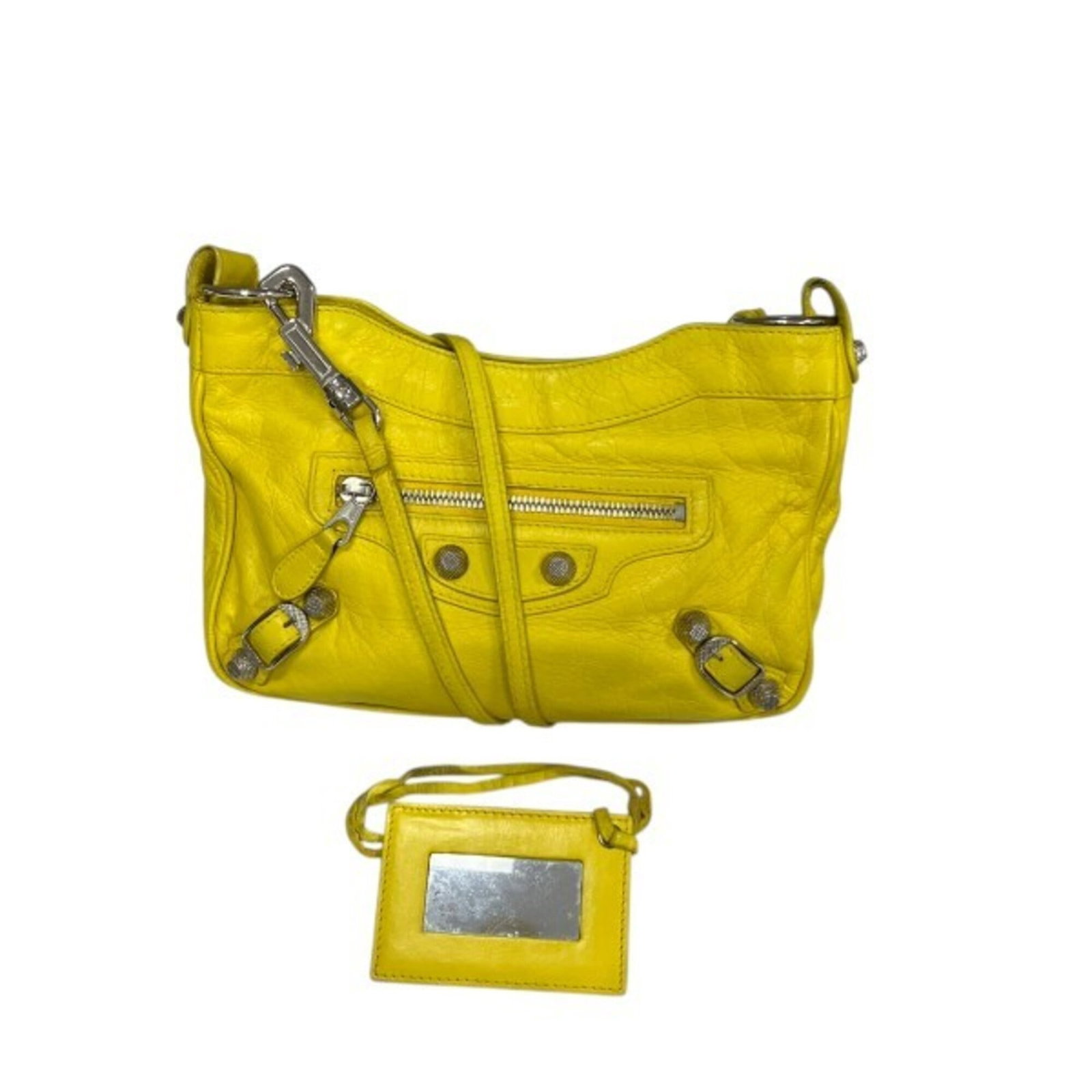 Balenciaga Handbag Shoulder Bag Leather: Balenciaga Handbag Shoulder Bag Leather The Balenciaga Handbag Shoulder Bag Leather features a vibrant yellow calfskin material, making it a striking accessory. With its structured design and