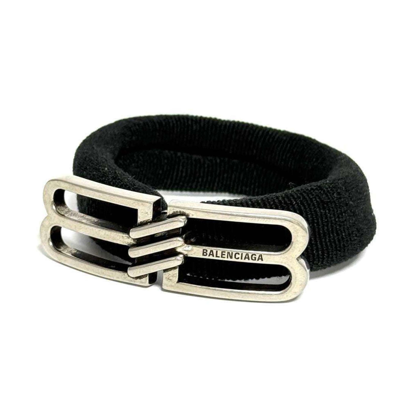 Balenciaga Hair Tie Metal: Balenciaga Hair Tie Metal Metal hair tie from Balenciaga, measuring 1.6cm x 5.5cm, comes in a box and dust bag. This metal hair tie bears a signature, which can be noted but not claimed to belong to a