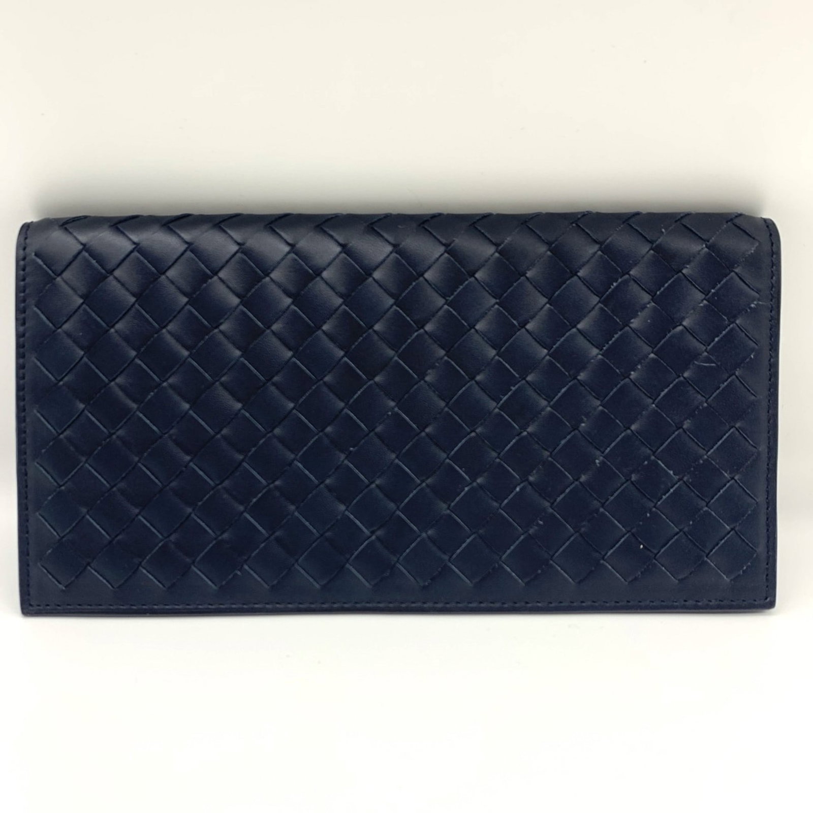 Bi Fold Leather Bill Wallet Bottega: Bi Fold Leather Bill Wallet Bottega Bottega Veneta's Intrecciato line is renowned for its distinctive woven leather design. This bi-fold bill wallet features navy leather and a classic flap closure,