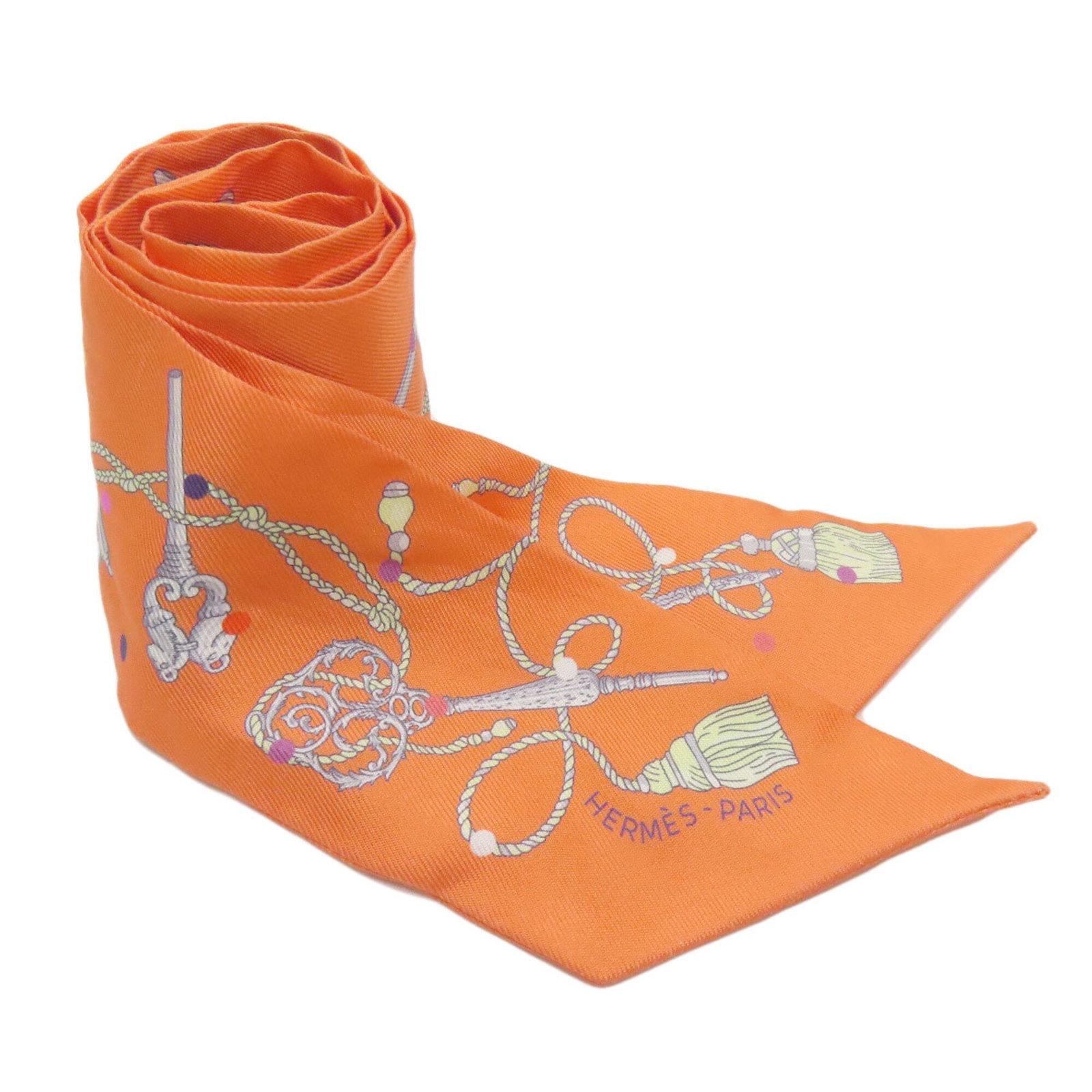 Hermes Silk Scarf: Hermes Silk Scarf Soft to the touch, this vibrant orange silk scarf from Hermes features a classic Twilly design. Made from high-quality silk, its compact size makes it perfect for adding a pop of