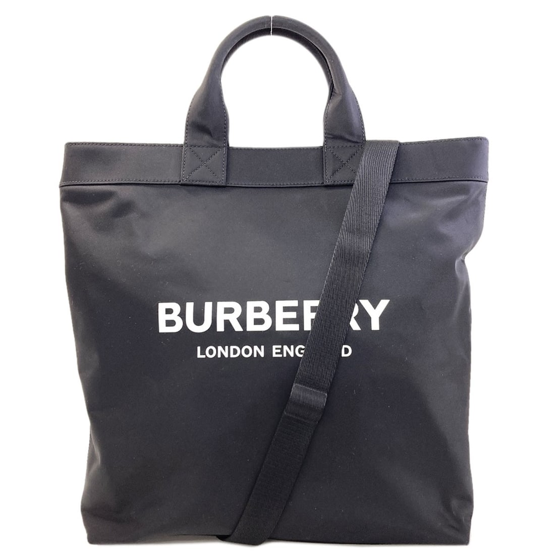 Nylon Handbag 2Way Burberry: Nylon Handbag 2Way Burberry Black Nylon Handbag with Burberry Style. This BURBERRY handbag features a black exterior made from nylon, offering a durable and versatile design. With its classic style