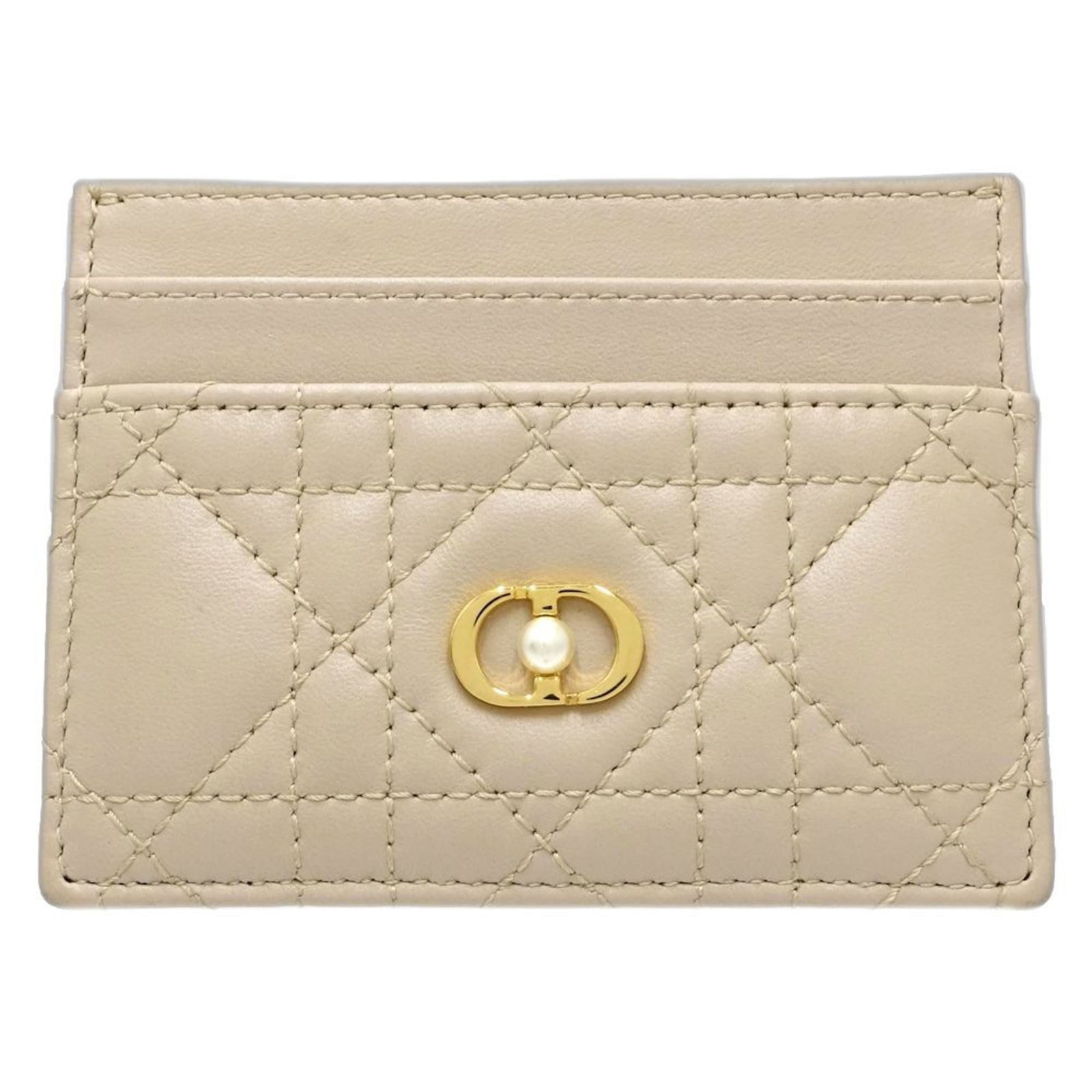 Christian Dior Leather Business Card Case: Christian Dior Leather Business Card Case Christian Dior's signature lambskin business card case boasts understated elegance in its natural beige hue. Made from high-quality leather, the compact desig