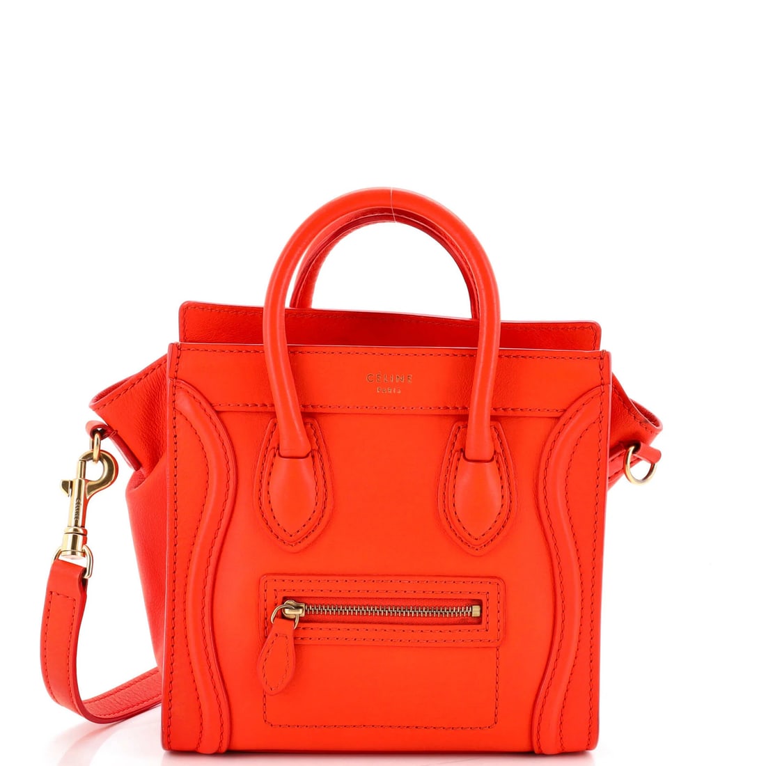 Luggage Bag Smooth Celine Leather Nano: Luggage Bag Smooth Celine Leather Nano The Celine Luggage Bag Smooth Leather Nano boasts a vibrant orange exterior, complemented by matching interior and gold hardware. Measuring just 3" in handle dro